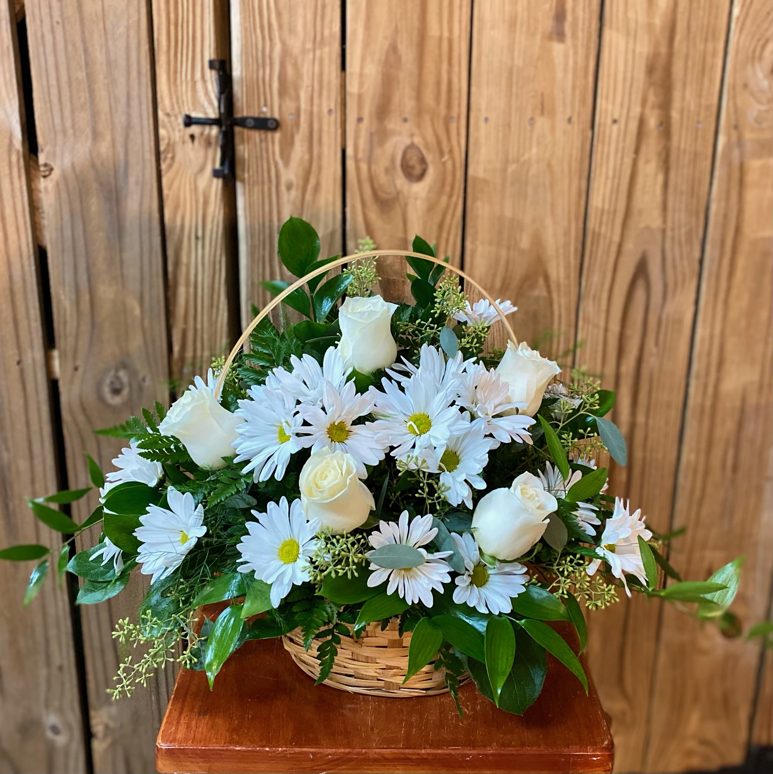 Pristine by BloomNation™ Pristine by BloomNation™ - A peaceful white and green basket featuring white daisy mums and white roses with greenery in a basket. Send your sympathies to the home with Pristine by BloomNation™ Approximate Dimensions: 14"D x 10"H