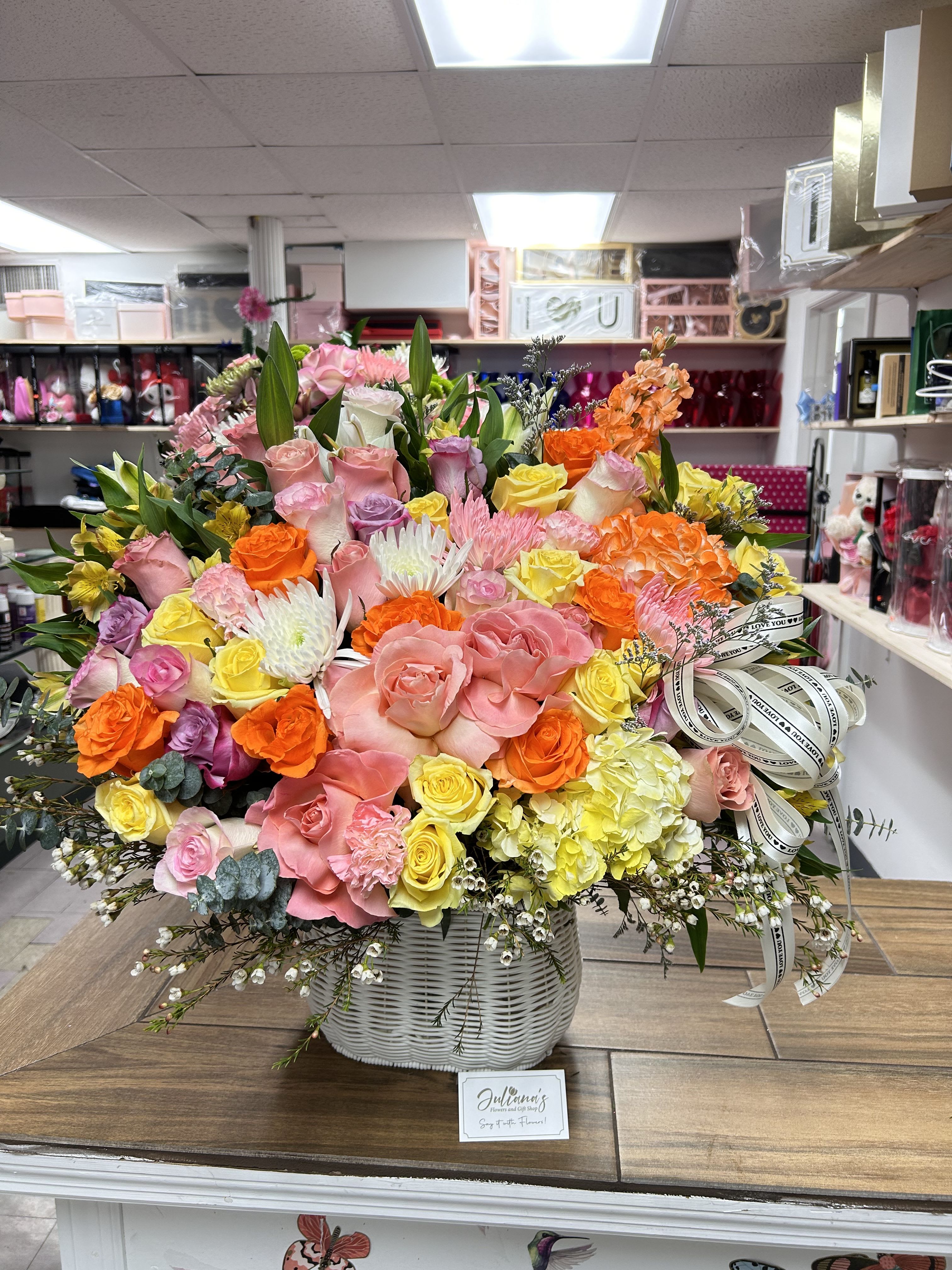 Large white basket with assorted seasonal flowers - Large white basket with assorted seasonal flowers