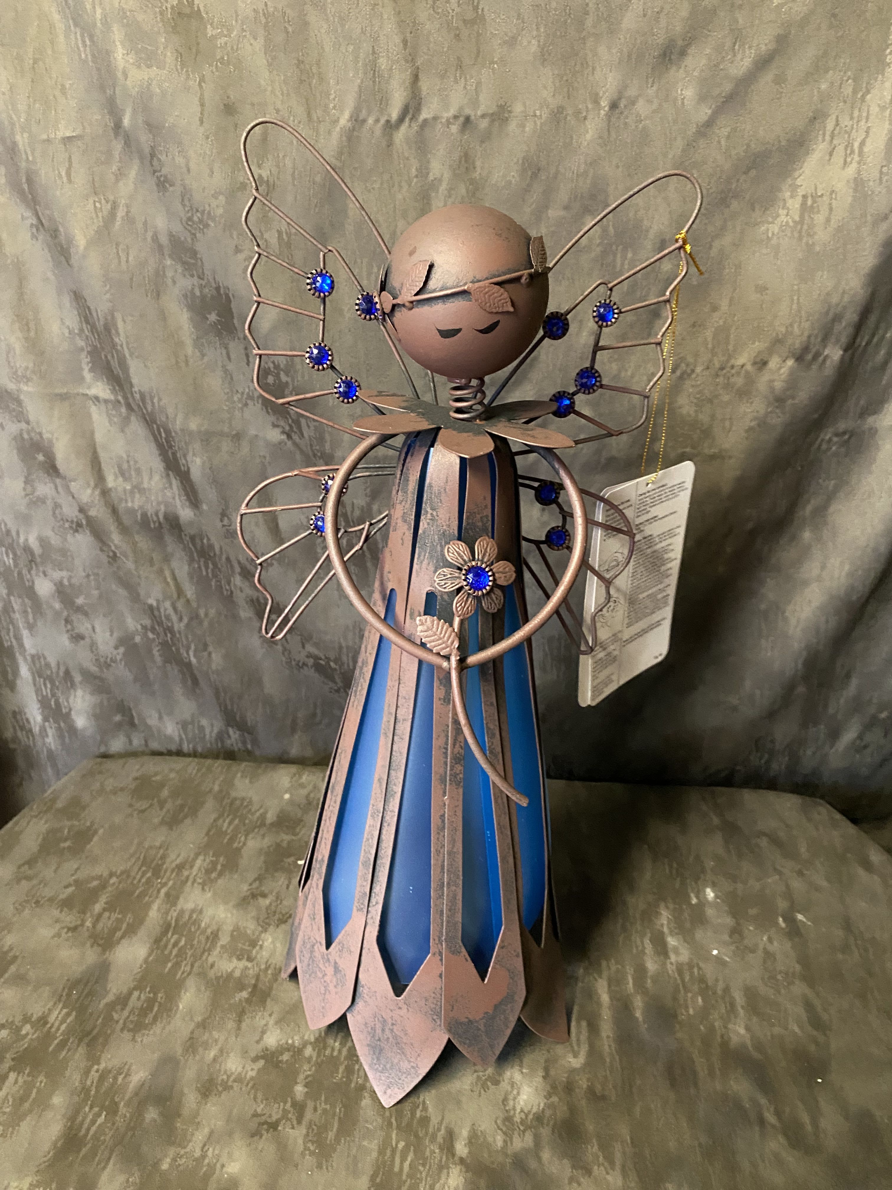 Solar led blue garden Angel  - solar-powered Cemetary or Garden products an artful sculpture by day and a luminous accent at night light weight Angel  16 inches High 8 inches wide  Standard Angel only  Deluxe price Angel with silk flowers  Premium Price Angel with Fresh Flowers