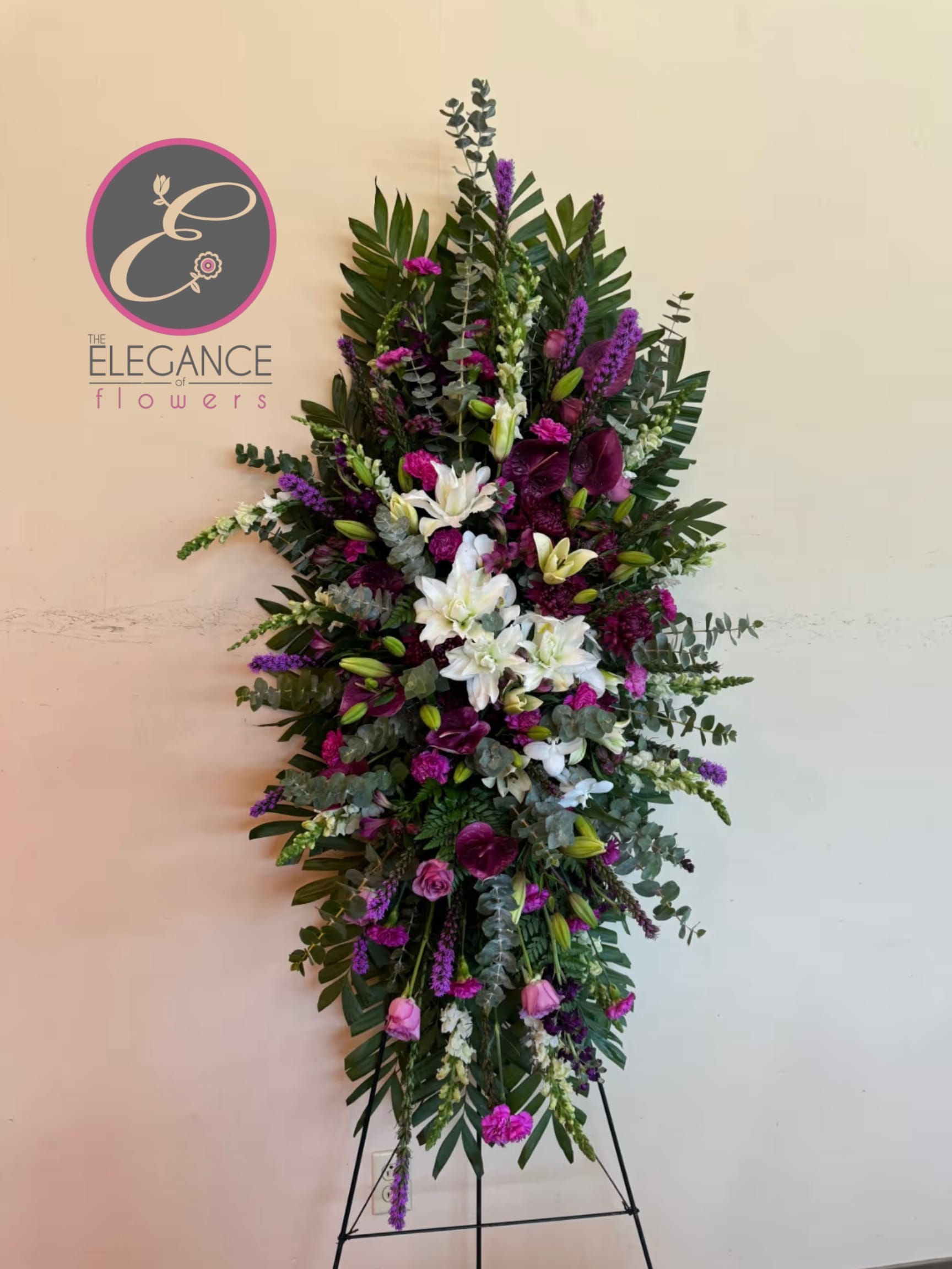 Easel #12 Online Easel #12 Online - A standings flower arrangement for a funeral service is a heartfelt tribute designed to honor and celebrate the life of the deceased. These arrangements are typically displayed on an easel or stand, making them highly visible and a central part of the memorial decor.