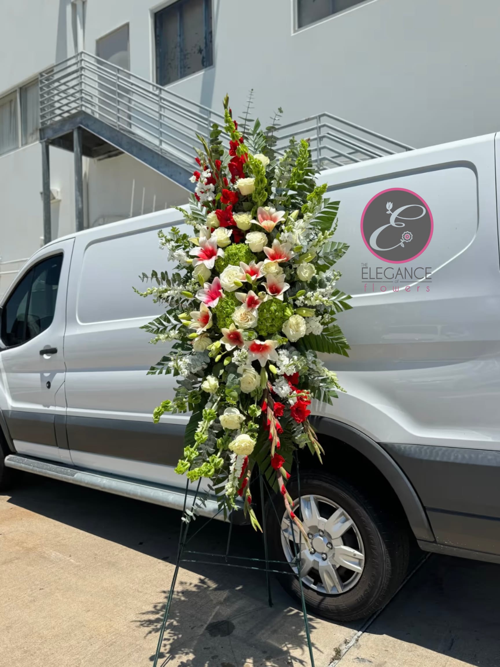 Easel #2 Online Easel #2 Online - A standings flower arrangement for a funeral service is a heartfelt tribute designed to honor and celebrate the life of the deceased. These arrangements are typically displayed on an easel or stand, making them highly visible and a central part of the memorial decor.