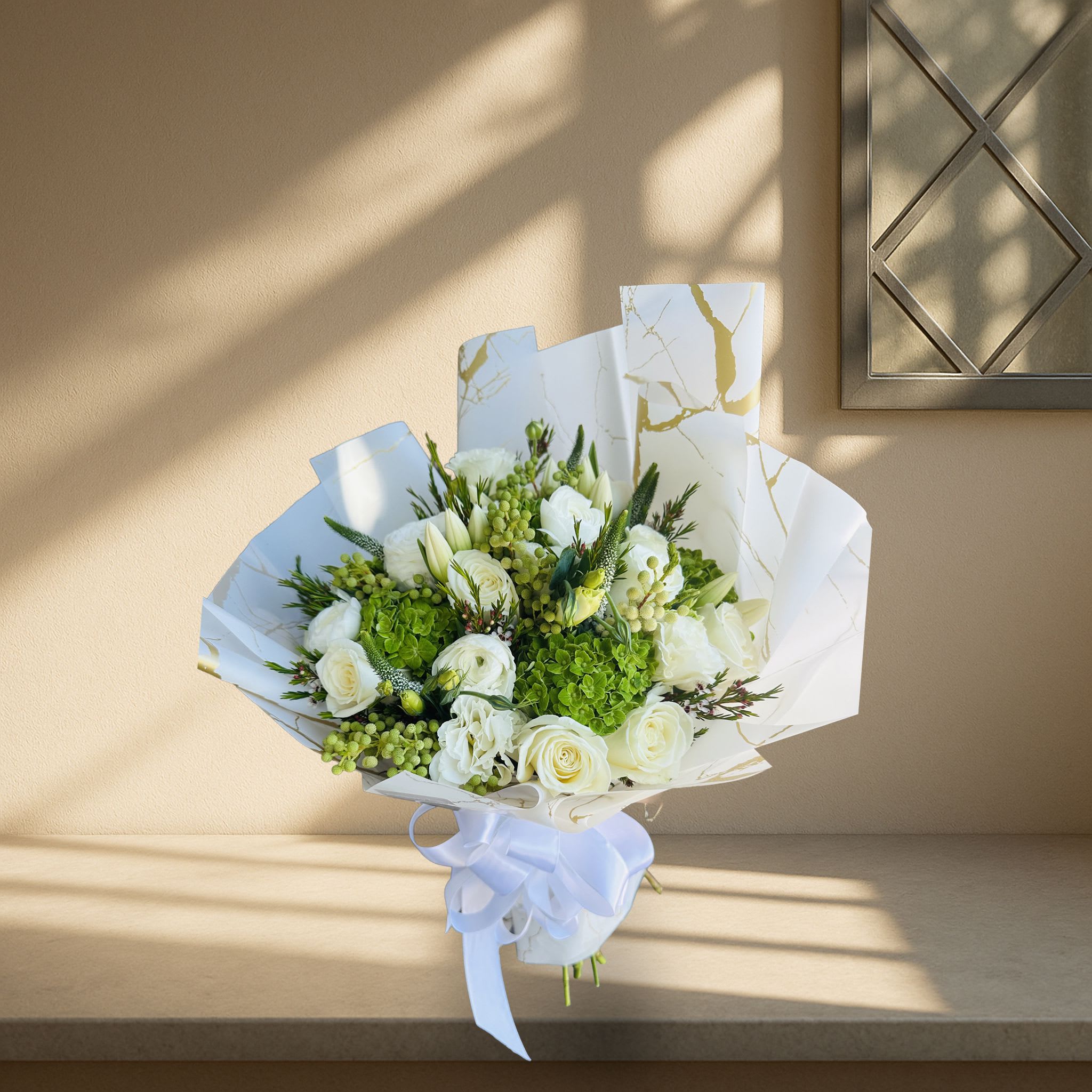 Touch of Hand Tied white Touch of Hand Tied white - Whites and greens selectively chosen and wrapped with a fashionable white stylish paper