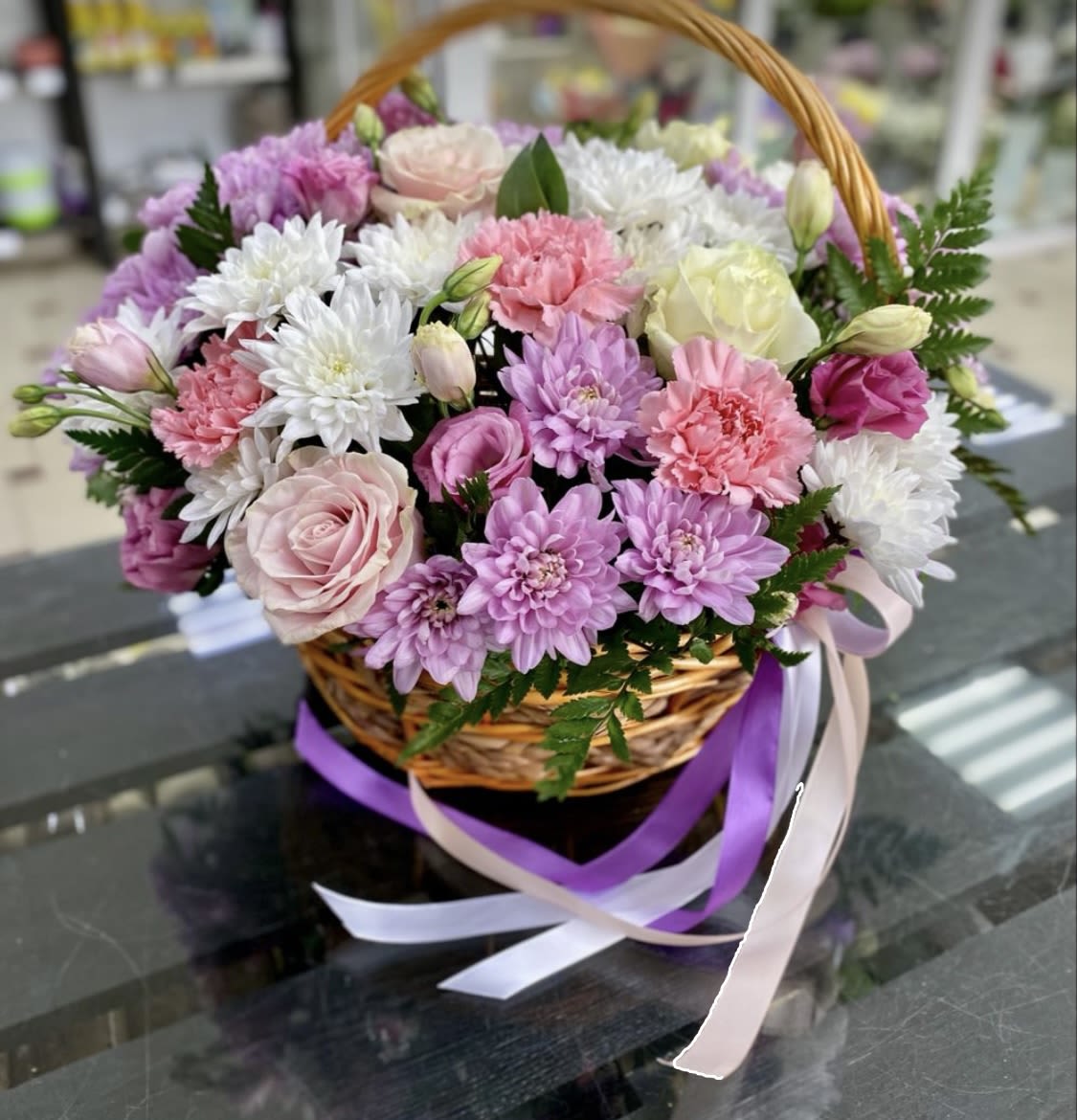 Basket with varied seasonal flowers Basket with varied seasonal flowers - Basket designed by the florists of Juliana's flowers with seasonal flowers, daisy, chrysanthemums, roses spray roses and foliages