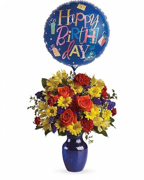 Fly Away Birthday Bouquet - Brilliant orange roses, yellow alstroemeria, red carnations and miniature carnations, yellow daisy spray chrysanthemums, purple statice and a big bright balloon are all delivered in a beautiful cobalt blue vase. It's a thumbs-way-up choice in birthday gifts!  