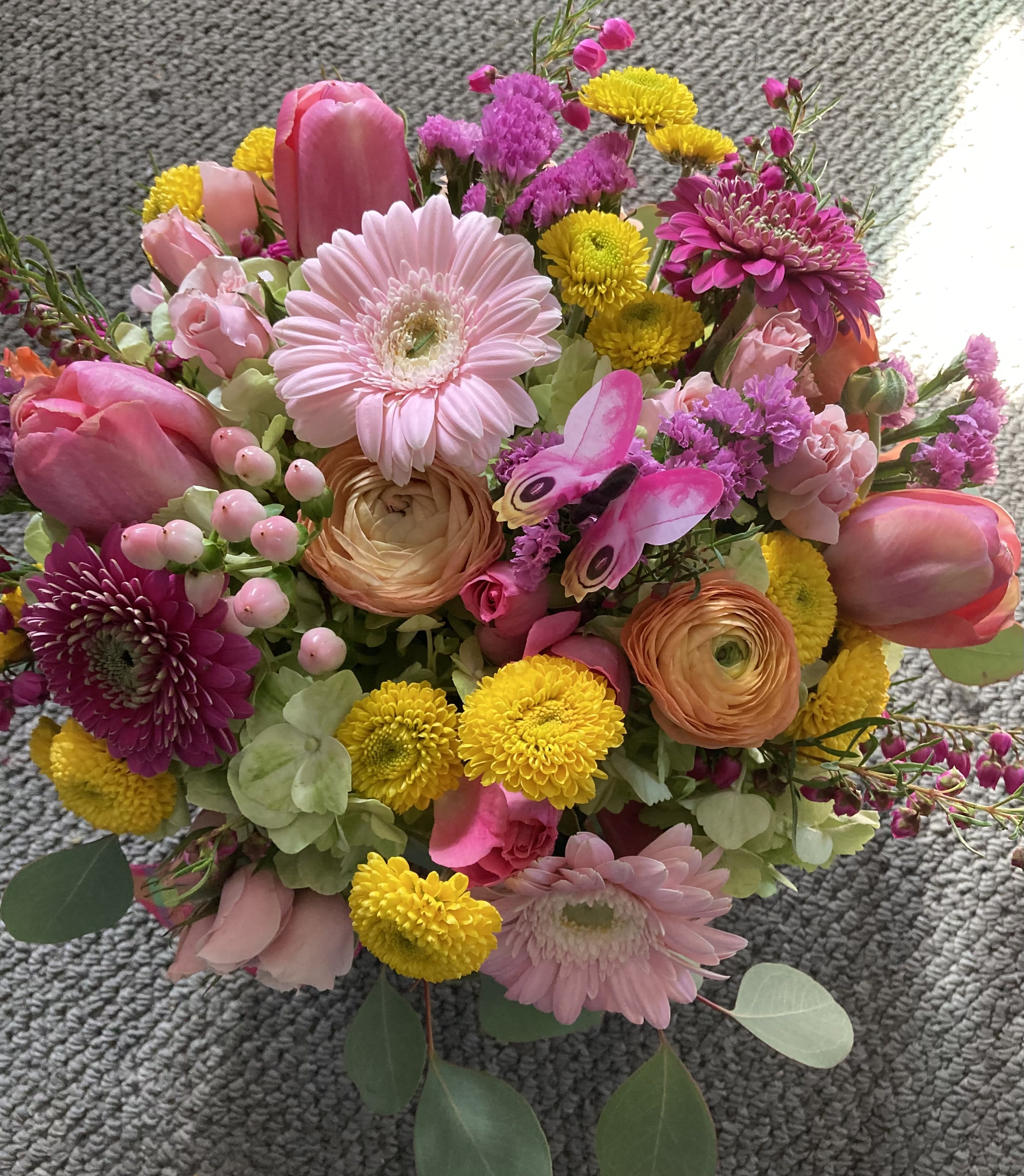 Daydreaming - A colorful, mixed bouquet with tulips, gerberas, ranunculus, hydrangea, and button pomps. Will brighten up any occasion!