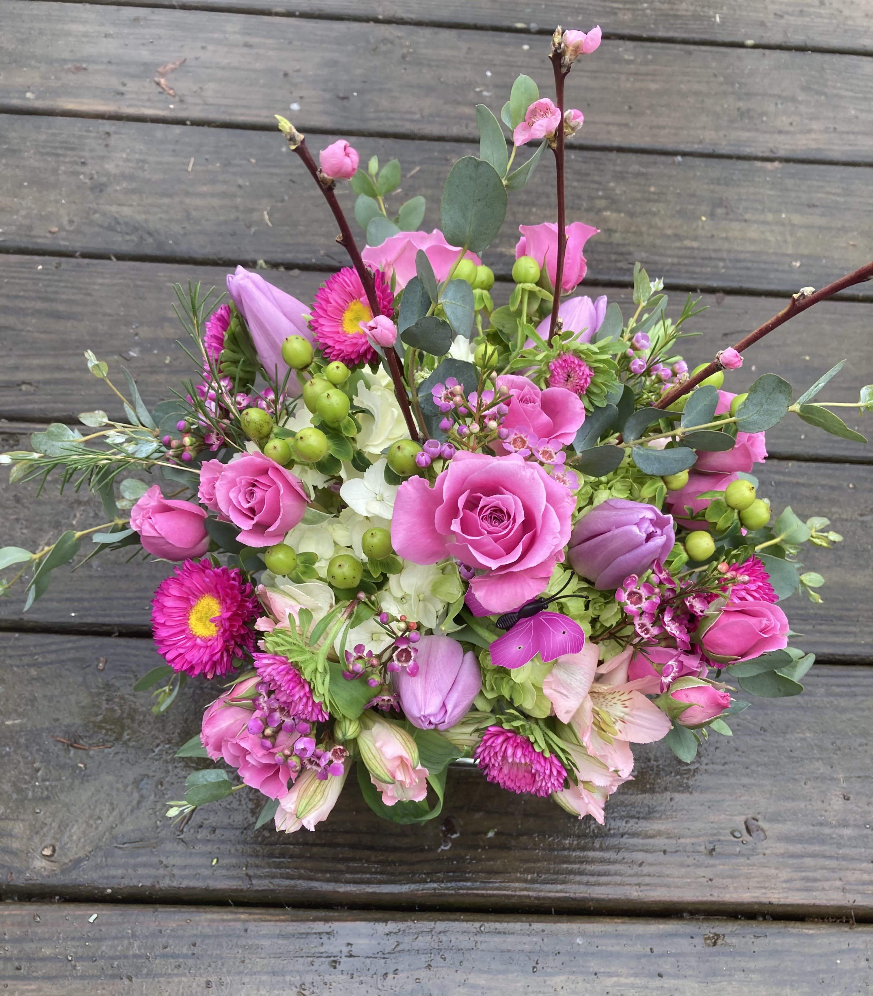 Spring in The Pink - Pink spray roses, matsomoto asters, tulips and hydrangeas. (Blooming twigs only when in season) Send for any occasion, birthday, just because, get well or thinking of you. 