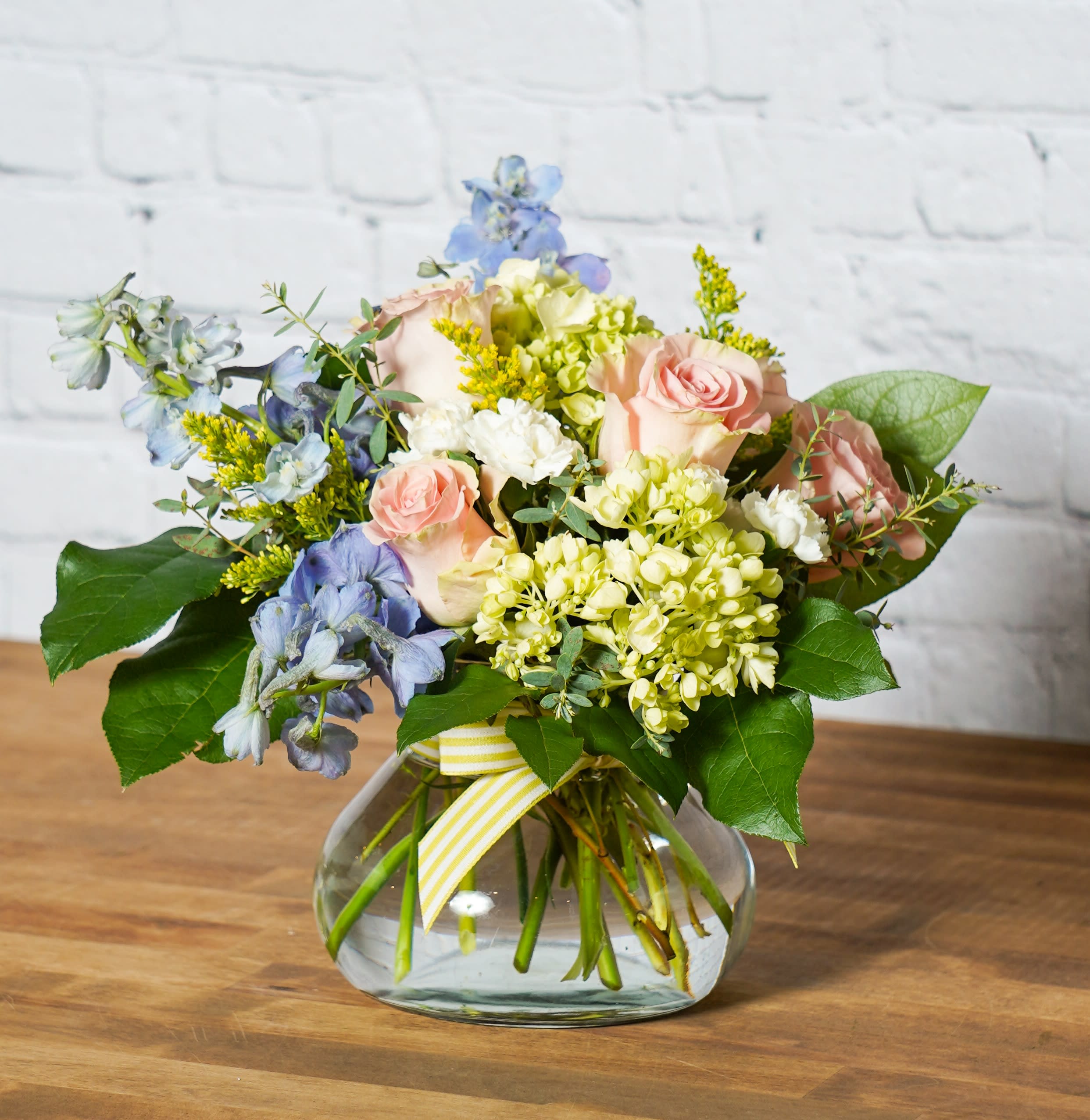 Love, Hailey - Sweet and Semi-petite.... the Love, Hailey arrangement is the perfect spring arrangement to say what you need, without being over the top.   Please Note: Standard Delivery for this product occurs in the afternoon, between 2:30pm and 7pm. If you need it by a certain time, there is an option to select a timed window for scheduled deliveries.