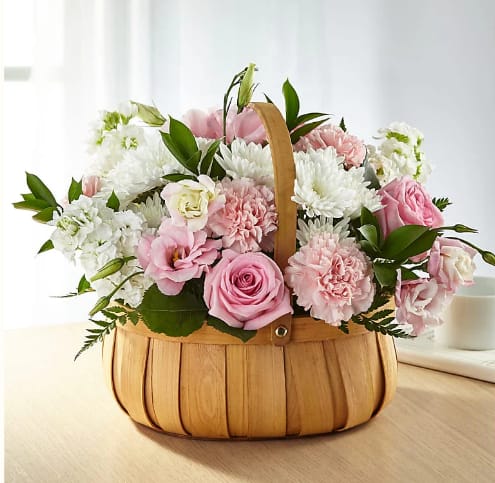 Always Graceful Basket Always Graceful Basket - Beautiful arranged lisianthus, roses and stock in a woodchip basket. A sweet fragrant delight to enchant anyone's day.