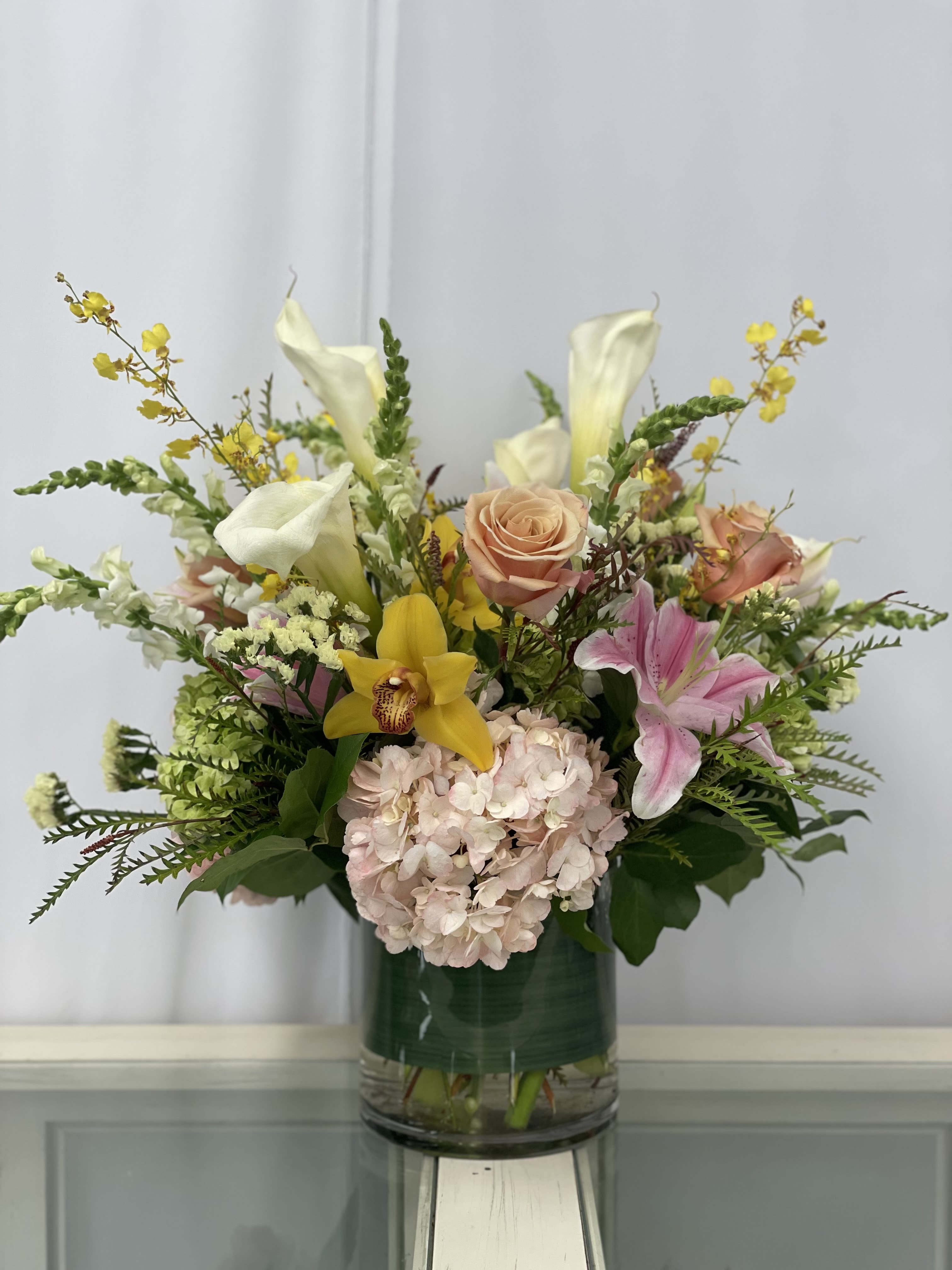 Petals &amp; Poetry - Like a gentle stroll through a sun-dappled meadow, this wildflower arrangement captures the effortless beauty of nature in bloom.