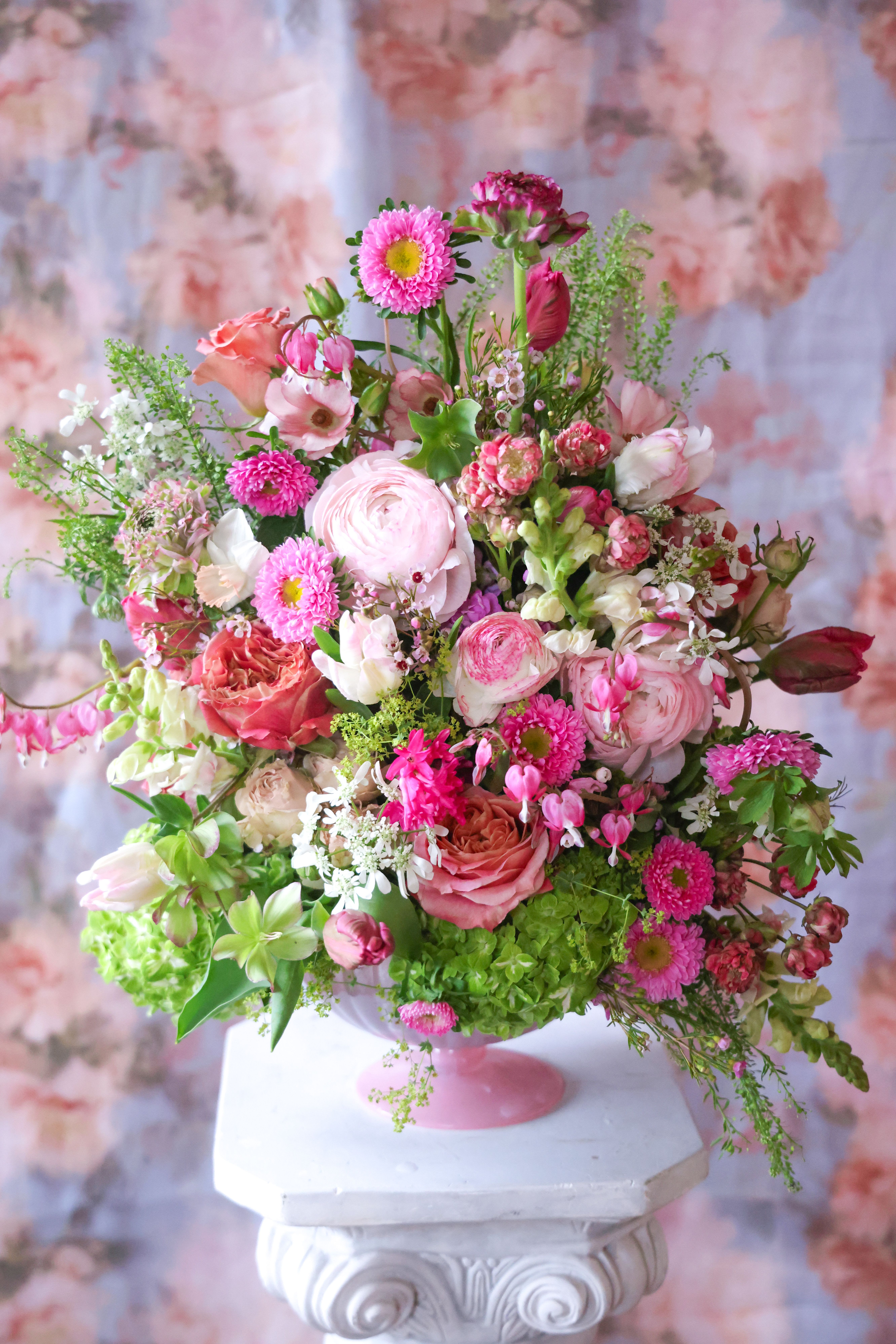 The Garden Song Arrangement -  A glorious garden song for the Mothers that tend the hearts of young and old alike. Mothers are the vernal fountains, always bringing forth a tireless level of caring and love. If there was a place to nuture the heart and being of Mothers, it is nestled in the Garden Song Arrangement. Brimming with decadent, natural beauty, sing a song of love, appreciation and honoring your Mom with this blessed bountiful, floriferous array.