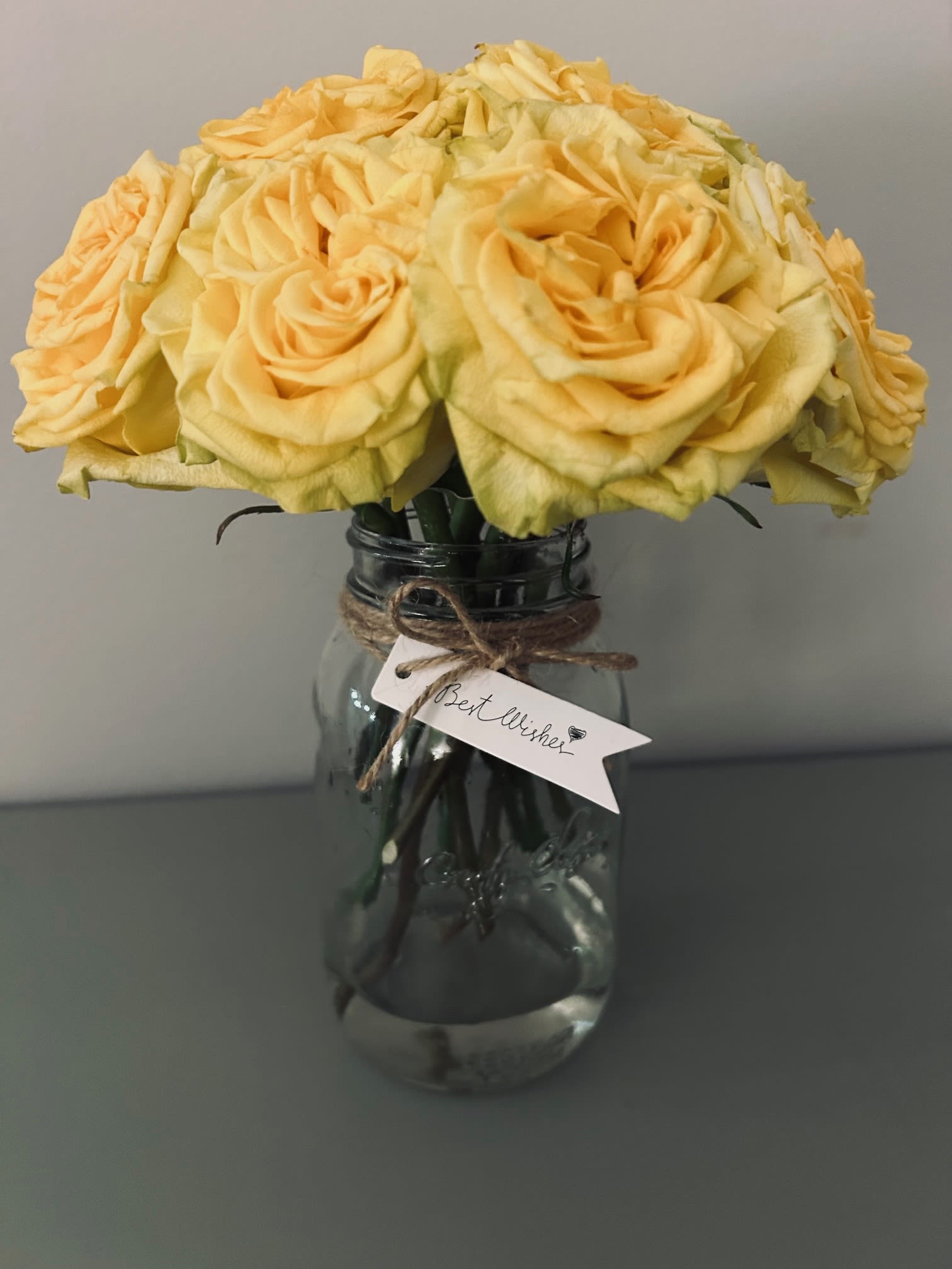 Southern Sunshine  - A cheerful bouquet of roses, delicately prepared and arranged in a medium mason jar, tied with twine. Bouquet can be made with any color rose and special occasion tag. Please let designer be aware if preferences differ from design shown.