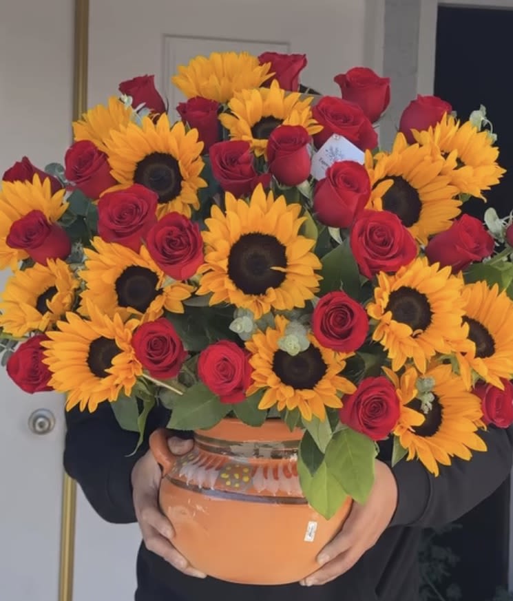 Madrecita Querida  - Large Centerpice with Red Roses and Bright Sunflowers expertly designed just for her in a beautiful Olla De Varro
