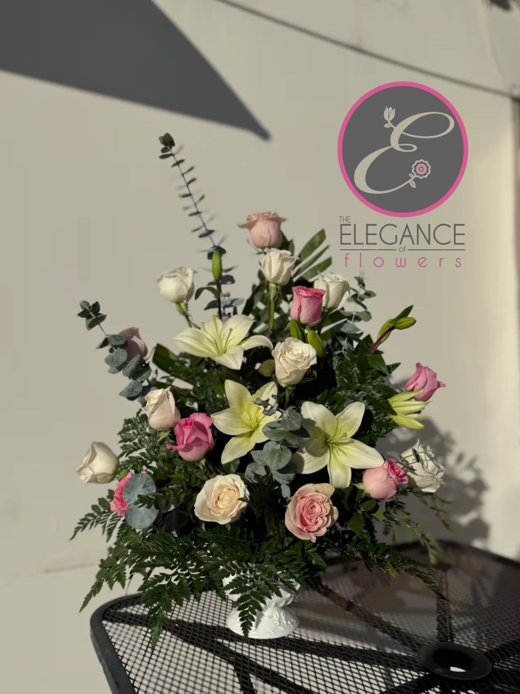 Pedestal Arrangement #6 Pedestal Arrangement #6 - A sympathy pedestal arrangement offers a heartfelt expression of condolence, featuring a carefully curated selection of serene and elegant blooms. Designed to convey comfort and peace, each arrangement is thoughtfully crafted with soft hues and gentle fragrances, providing a soothing presence during times of loss.