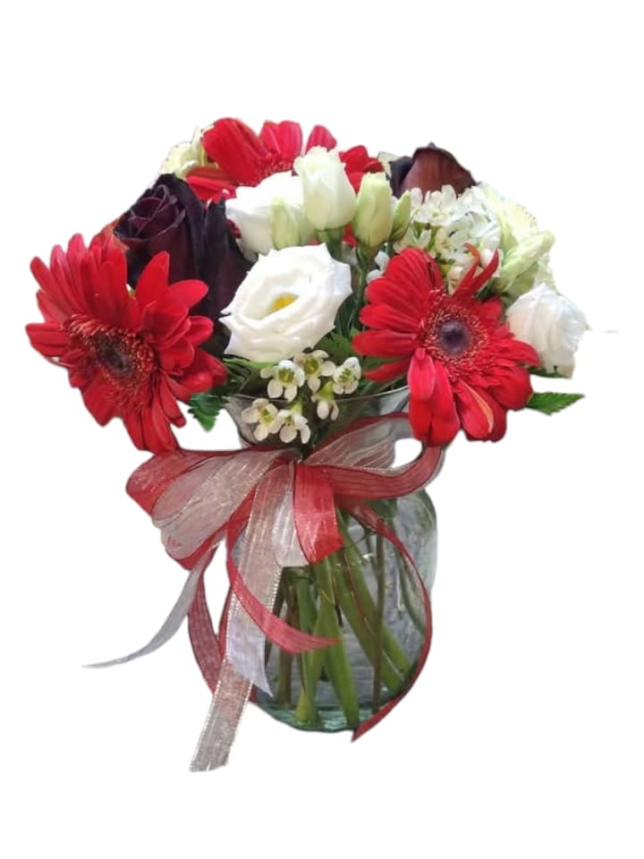 Scarlet Whispers - Introducing the Scarlet Whispers arrangement, where passion meets purity! This stunning bouquet of red and white blooms, elegantly nestled in a chic vase, is beautifully accented by striking black roses, creating a perfect contrast that will leave hearts fluttering. Ideal for any occasion, this floral masterpiece is sure to make a bold statement and brighten any space with its vibrant charm.