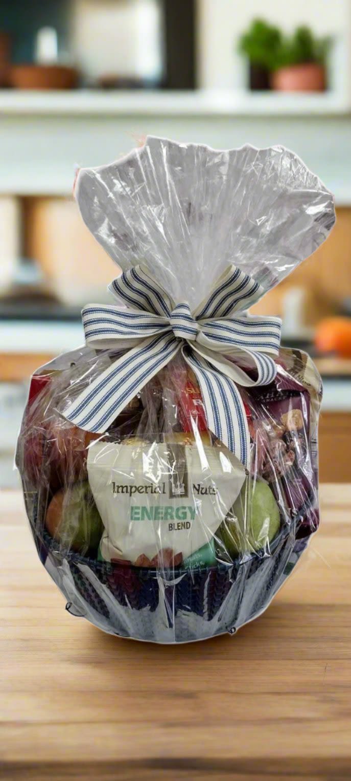Fruit &amp; Goodie Basket - An assortment of fresh fruits and snacks (such as candy, cookies, crackers, nuts and seeds, etc.) nicely arranged in a designers choice basket or container and wrapped with cellophane and a bow. Please provide 24 hours notice and make a note of any allergies etc. in the notes section or feel free to call or email us as well.