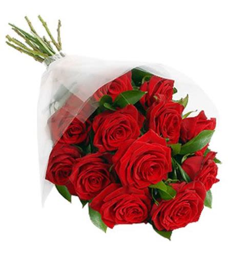 Dozen Red Roses Wrapped - A dozen red roses with greens and filler flower wrapped in a cellophane wrap with a bow. 