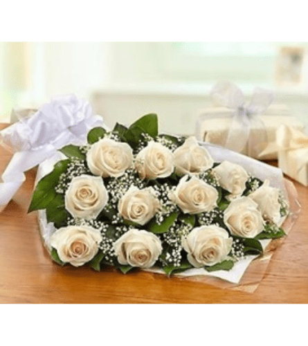 Dozen White Roses Wrapped - A dozen white roses with greens and filler flower wrapped in a cellophane wrap with a bow. 