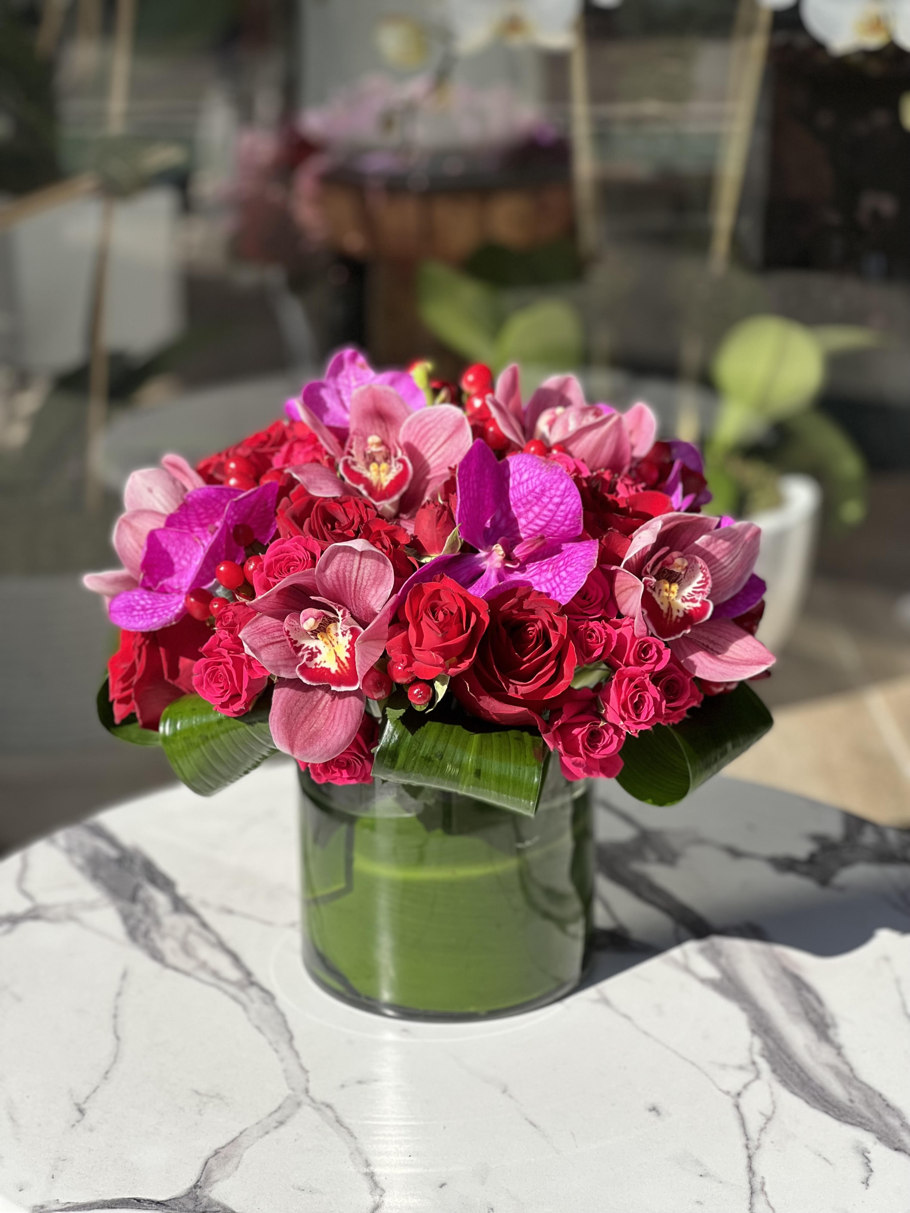 Love In The Air - The perfect Valentine's Day arrangement! A mix of pinks, reds and purples.