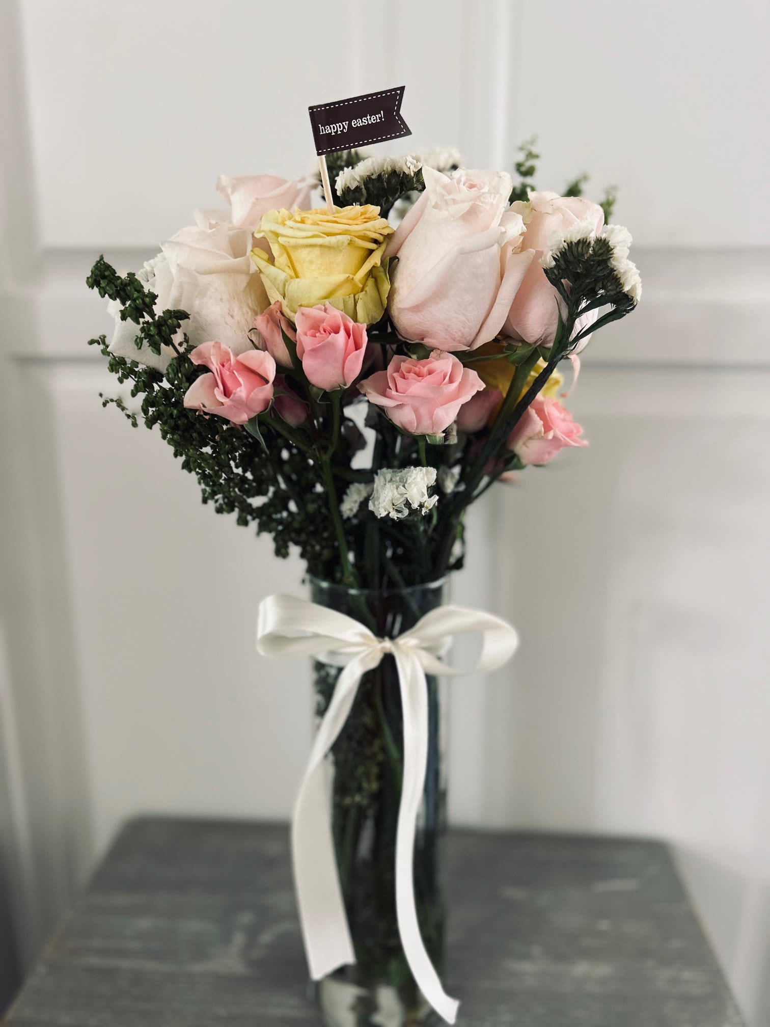 Holiday Arrangement - 6 fresh cut roses, and a small assortment of spray roses, delicately prepared and arranged with fresh foliage to create a beautiful arrangement perfect for any holiday! All colors and holiday cards available!