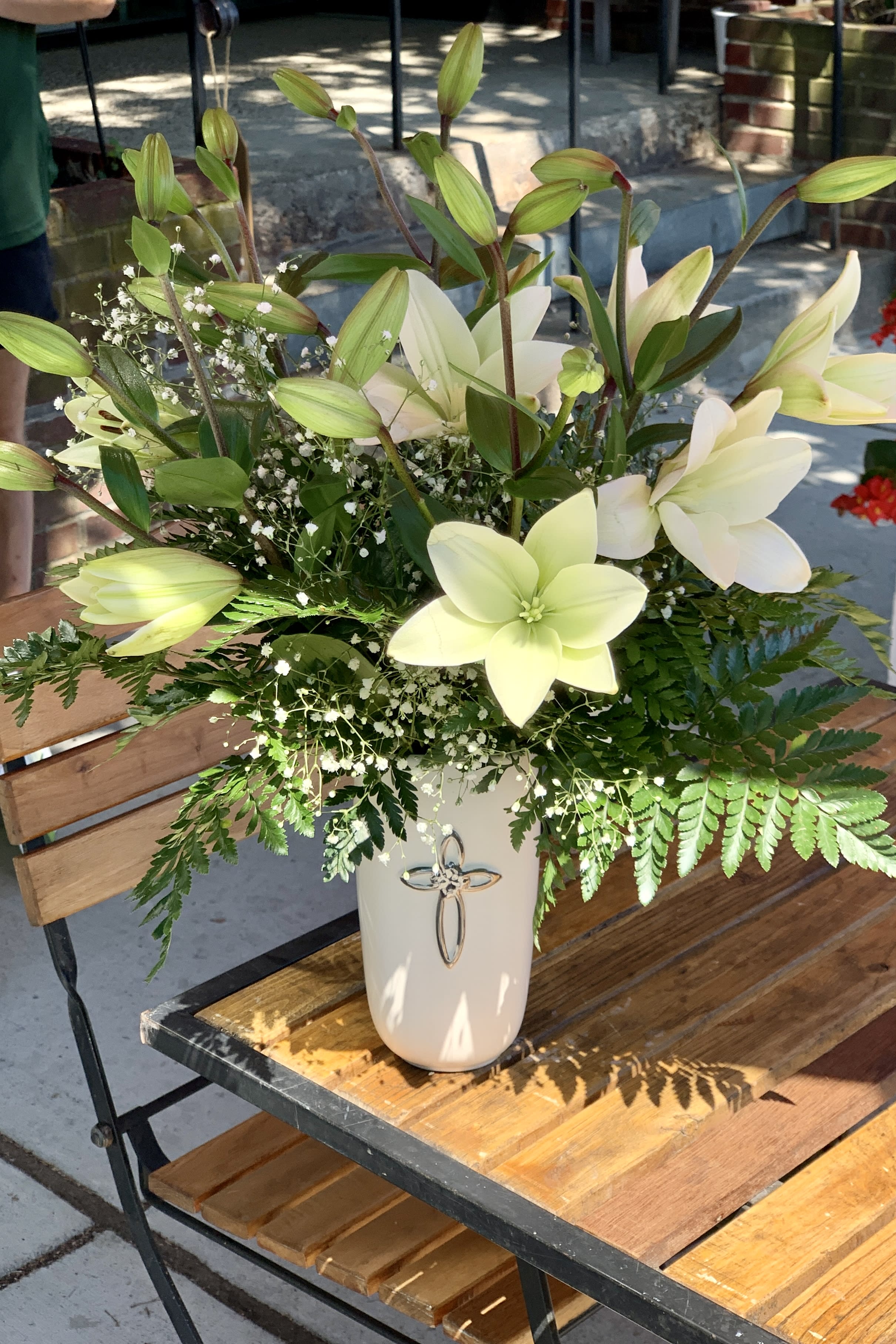 Faithful Blessings Bouquet Faithful Blessings Bouquet - Beautiful bouquet of all white Oriental Lilies in a keepsake white ceramic vase with a silver tone cross emblazoned on the front.