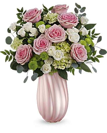 Sweetheart Twist Bouquet Sweetheart Twist Bouquet - Indulge Mom with the allure of soft pink roses and vibrant greens, beautifully nestled in our pearlescent glass vase for an unforgettable Mother's Day gesture.. Surprise Mom with a lush arrangement of green hydrangeas, pink roses, white spray roses, and accents of accents of green carnations, chrysanthemums, lush silver dollar eucalyptus, and huckleberry, elegantly displayed in Teleflora's Rosy Swirls vase this Mother's Day. Orientation: All-Around