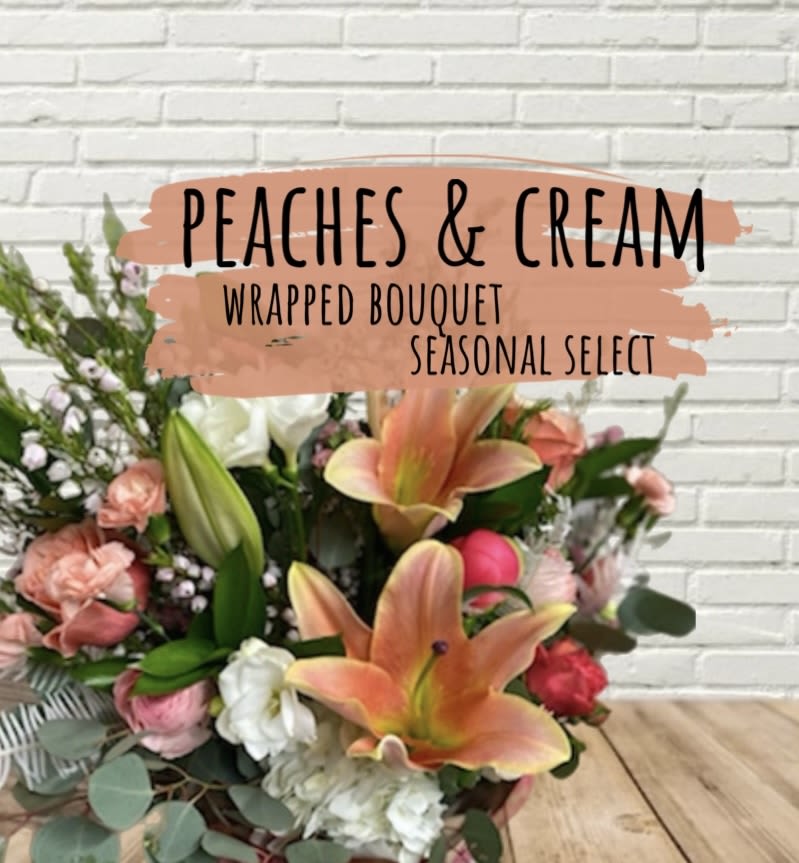 Peaches & Cream Wrapped Bouquet Peaches & Cream Wrapped Bouquet - A seasonal flower wrapped bouquet, designer will select the best blooms in season!