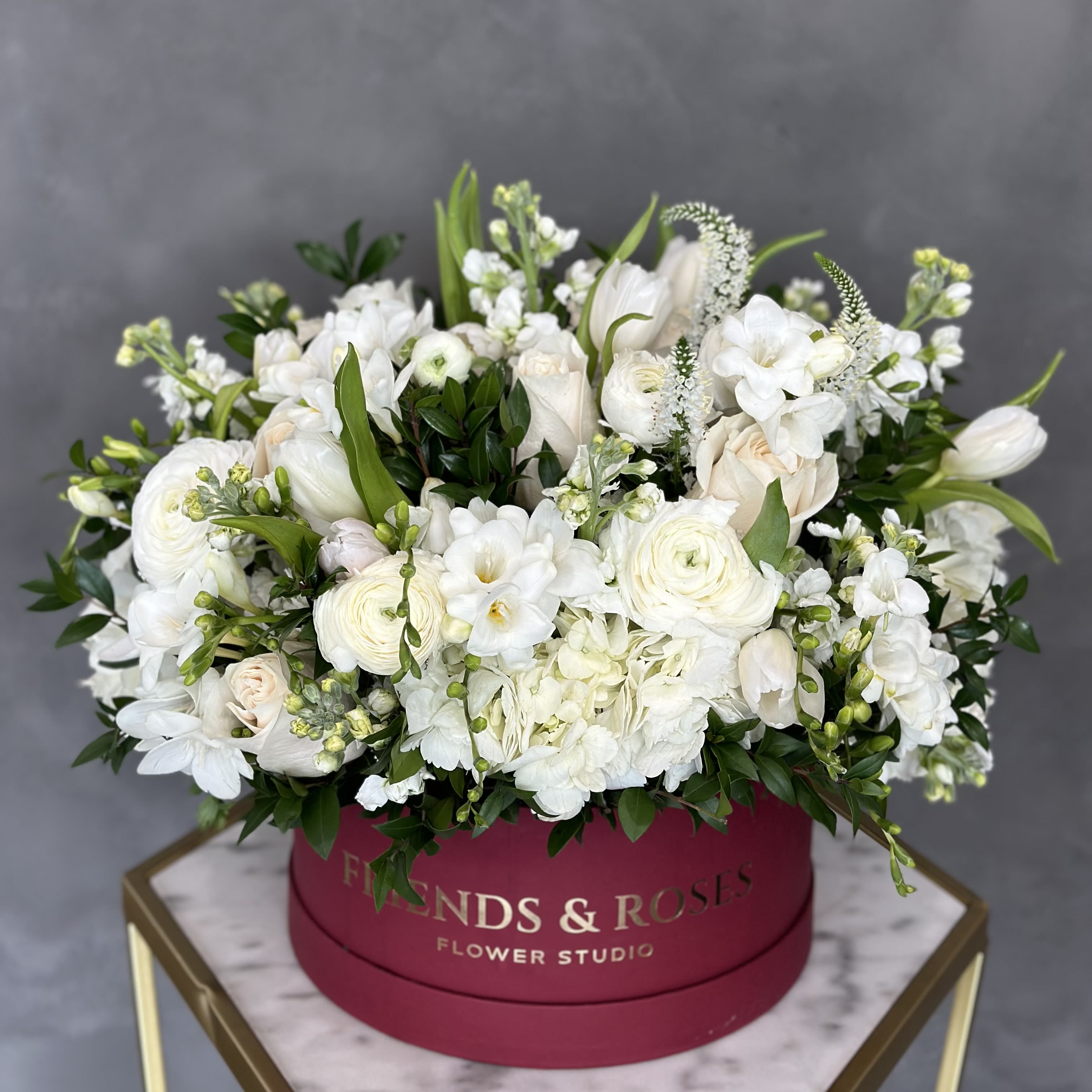 Emerald - Delicate white flowers paired with gentle green accents to create a soft and perfect gift  for expressing sympathy or celebrating new beginnings.