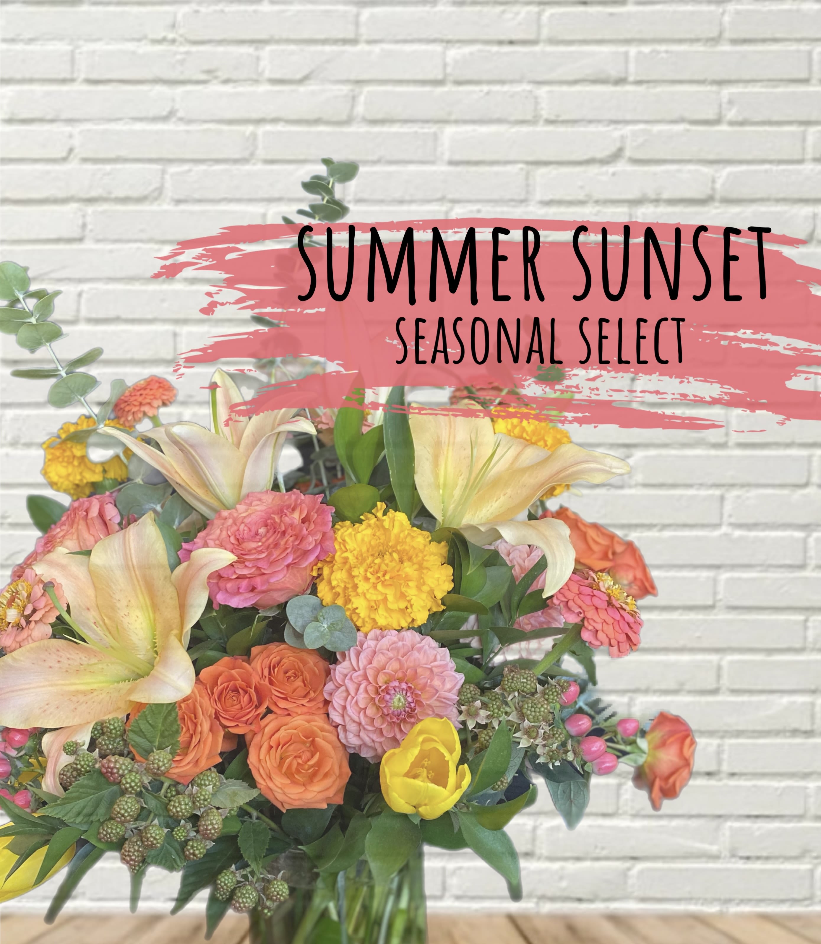 Summer Sunset Designer Select Summer Sunset Designer Select - A seasonal mix of flowers in the sunset coloring! This arrangement is created in a standard glass vase, each arrangement is creating specific to order and may differ from the stock photo.