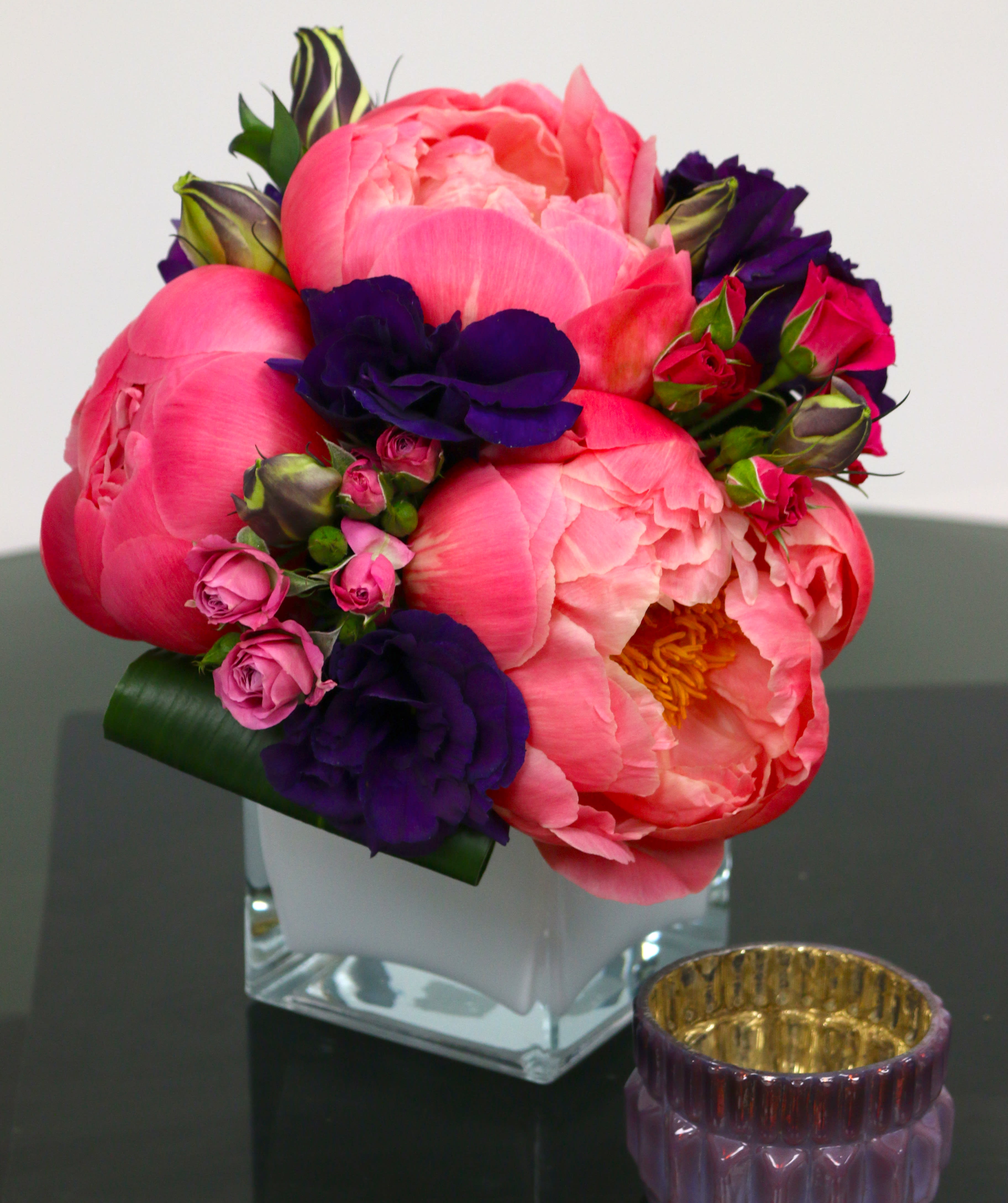 Joy of Love - Spring Delights the Senses! Peonies are the Dessert Flower of Spring. Arrangement featuring Peonies, Lisianthus and spray Roses in a glass vase. 