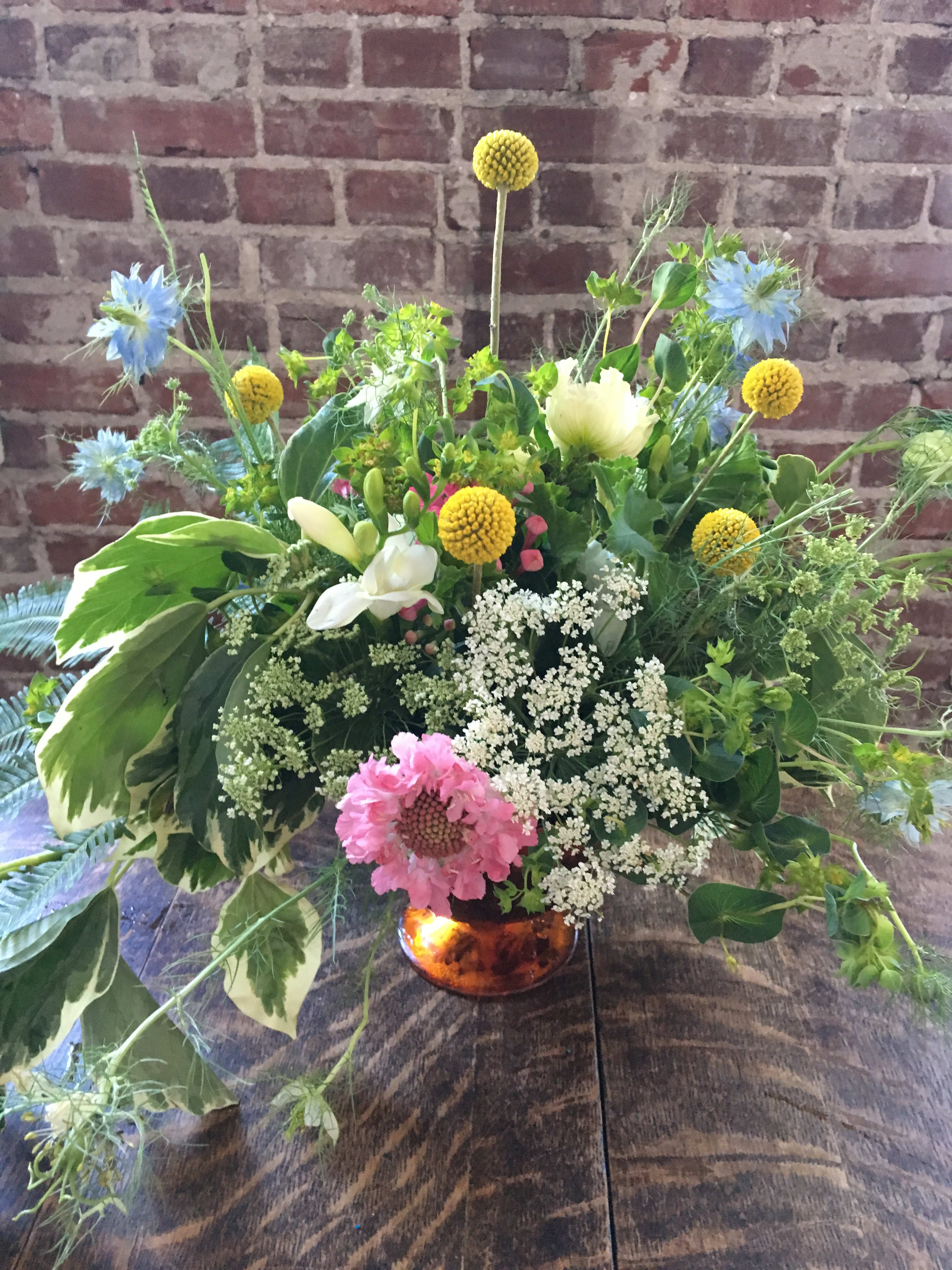 Flower Child Flower Child - Meadowy and sweetly filled with craspedia, scabiosa, Queen Anne's Lace and cornflowers this will surely make someone sigh.