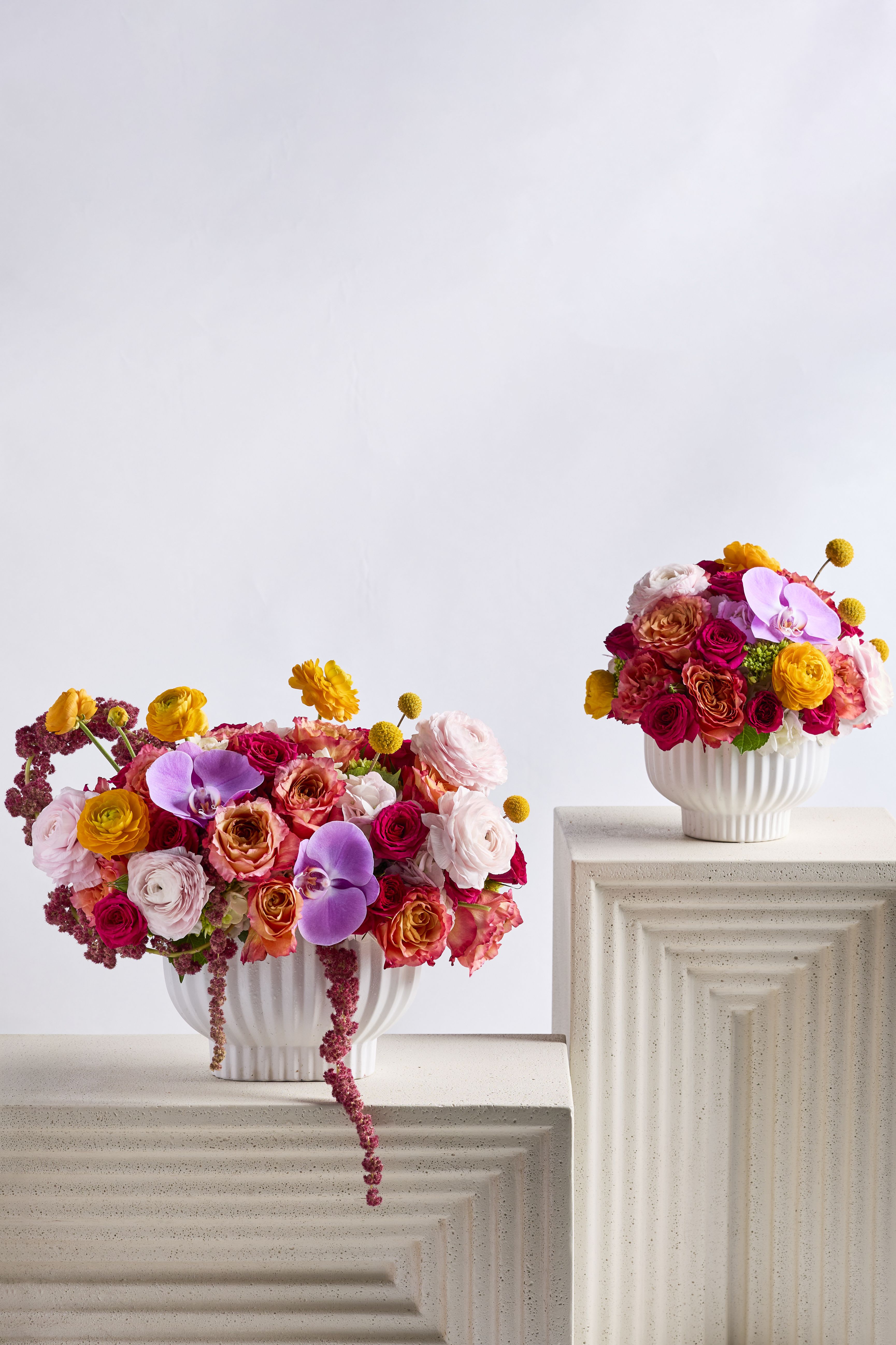 Sunset Glow - An enchanting arrangement that captures the essence of a glowing sunset with its vivid spectrum of colors