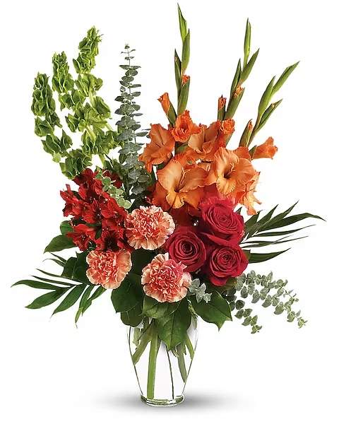 Days of Sunshine Bouquet - The exquisite bouquet includes red roses, red alstroemeria, orange gladioli, orange carnations and bells of Ireland, accented with assorted greenery. At a time when life seems gray, a vibrant array of red and orange flowers in a sparkling Ming urn can help soothe the troubled spirit.