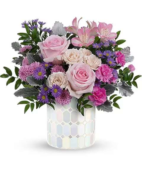 Alluring Mosaic Bouquet - Add a touch of elegance to any space with our iridescent mosaic glass cylinder, a timeless piece that sparkles with pastel shimmer, perfectly complementing a lush bouquet of pink and purple flowers, making it a cherished centerpiece for years to come. Indulge in soft, pastel shimmer with our iridescent mosaic glass cylinder, radiating elegance and charm, perfectly complemented by a bouquet of pink roses, crème spray roses, pink alstroemeria, hot pink miniature carnations, lavender button spray chrysanthemums, large purple monte cassino asters, dusty miller, and huckleberry for an enchanting Just because Gift