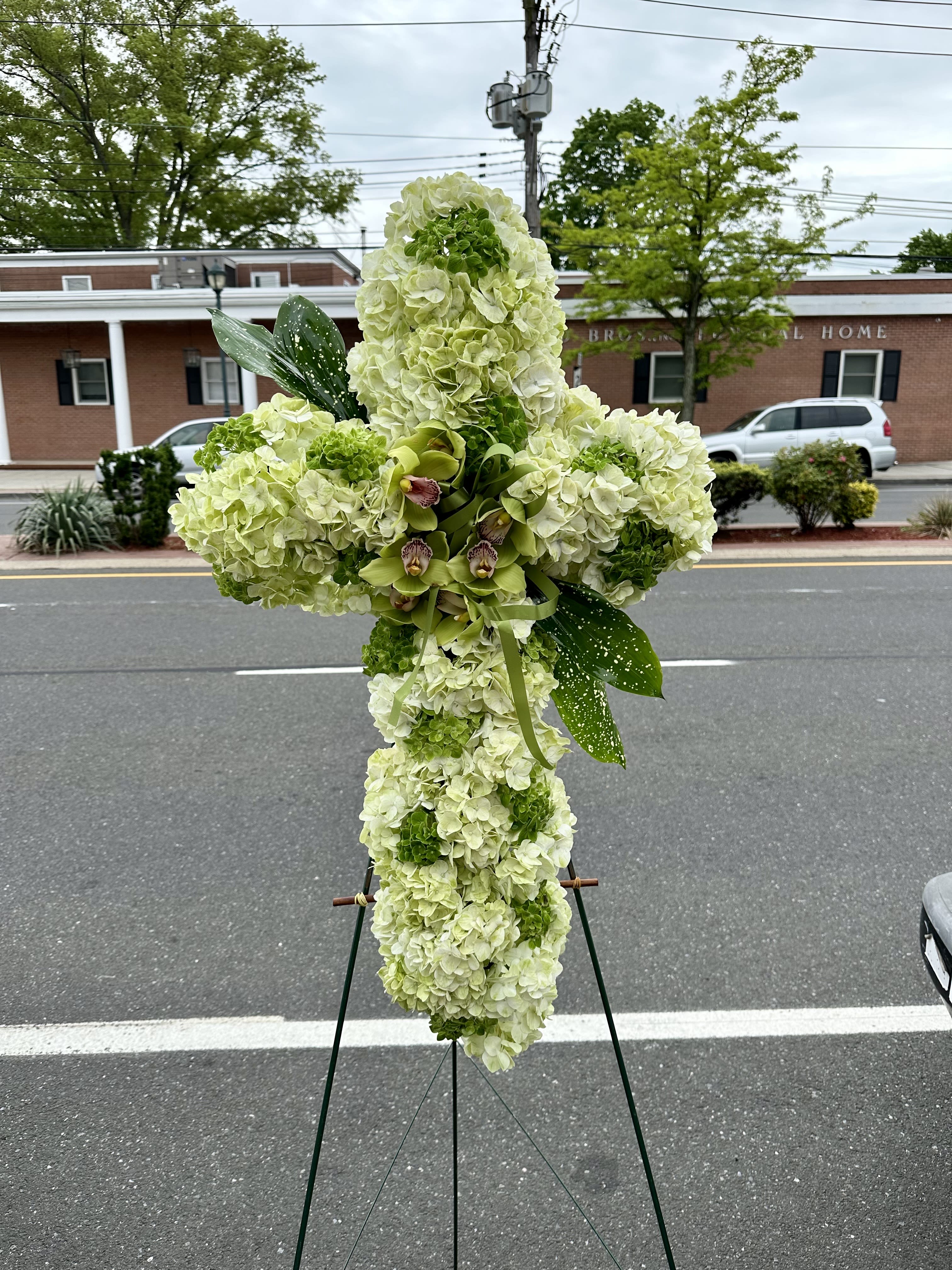 Divine Tribute Cross  (Deluxe Shown) - A breathtaking floral tribute that celebrates a soul’s sacred journey.