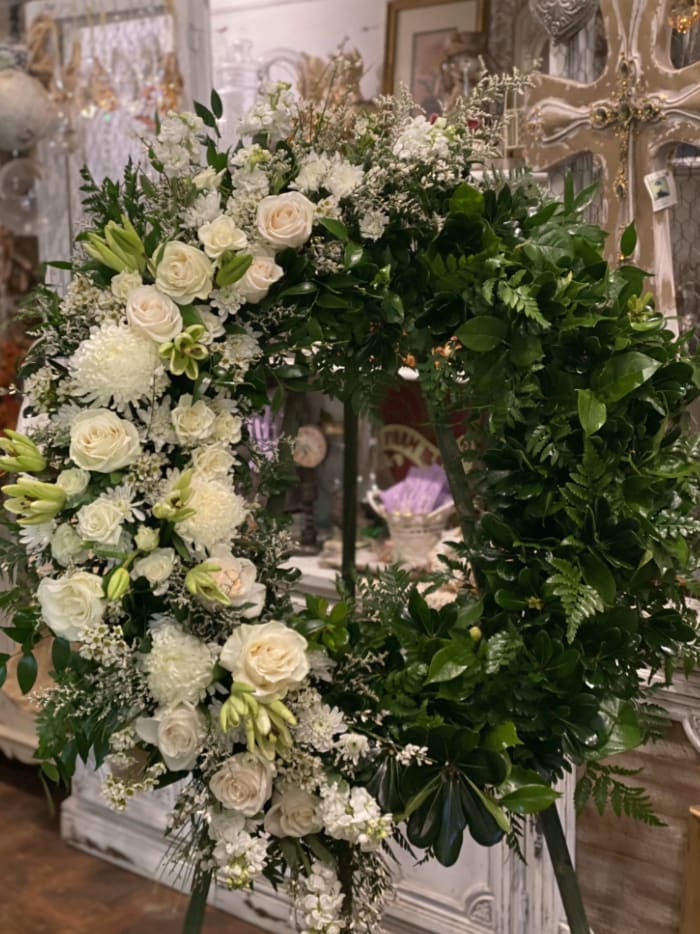 White Wreath with White roses and greenery White Wreath with White roses and greenery - Beautiful Wreath for special occasion. White roses with different types of greenery.