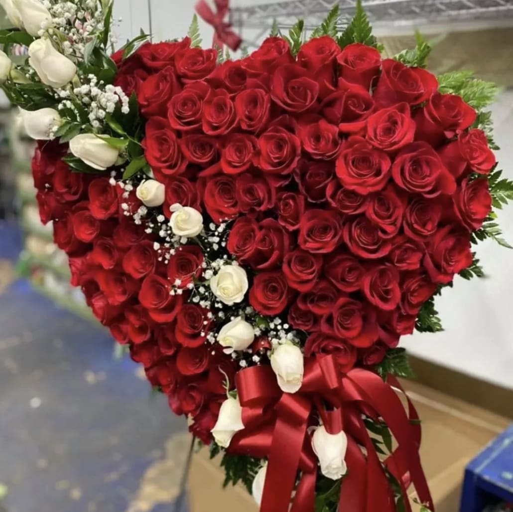 Beautiful and Elegant Heart Beautiful and Elegant Heart - Bleeding Heart Funeral Flowers with Red Roses from Houston Fresh Flowers. This beautiful floral tribute shows your undying love, loss, and sorrow during this difficult time. The bleeding hearts is timeless classic option that vividly displays how you feel. This heart can be created with roses of any color, just call our shop to discuss your options
