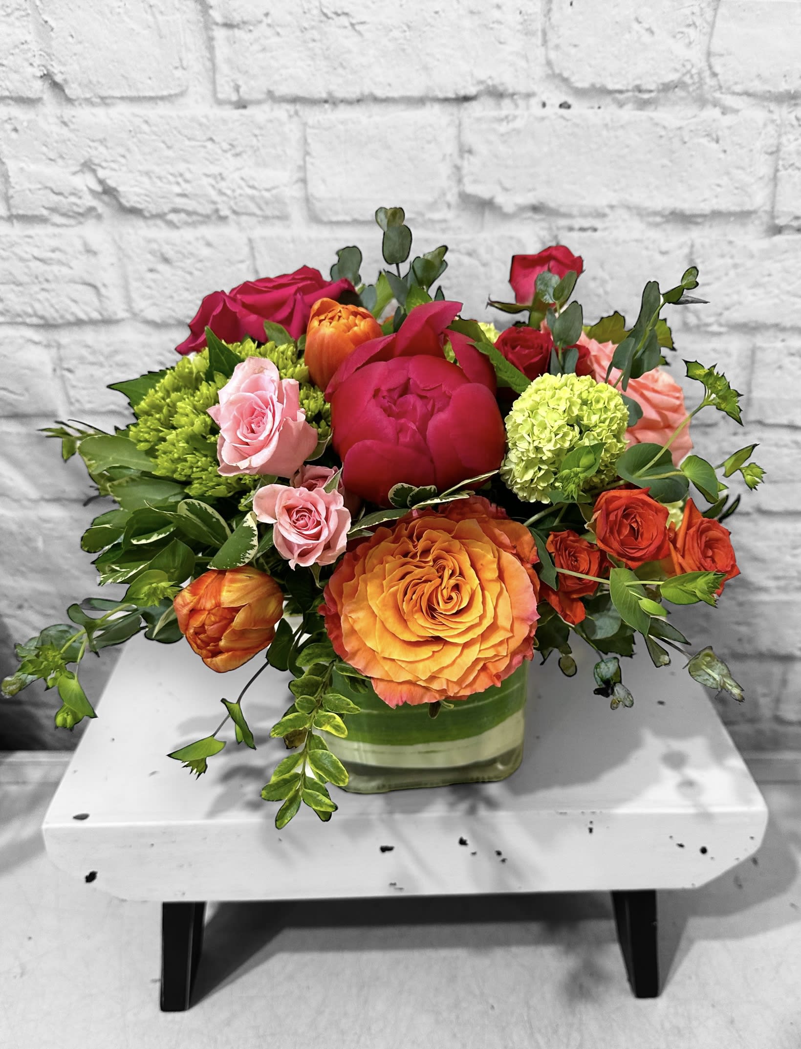 Lil’ Crush Lil’ Crush - A summer celebration of vibrant colors! This playful arrangement is enhanced with garden roses, spray roses, tulips, hydrangea and viburnum. Perfect flowers for birthdays, "get well soon," new baby, sympathy, congratulations, romantic gestures, and "Thank you." Also a beautiful wedding palette. Available for delivery in Seattle, Bellevue, Shoreline, and surrounding areas. Available for delivery in all neighborhoods in Seattle including Magnolia, Ballard, Fremont, Downtown, Queen Anne, Crown Hill, U District, West Seattle, International District, Capitol Hill, Pioneer Square, Beacon Hill, Columbia City, Georgetown, etc.