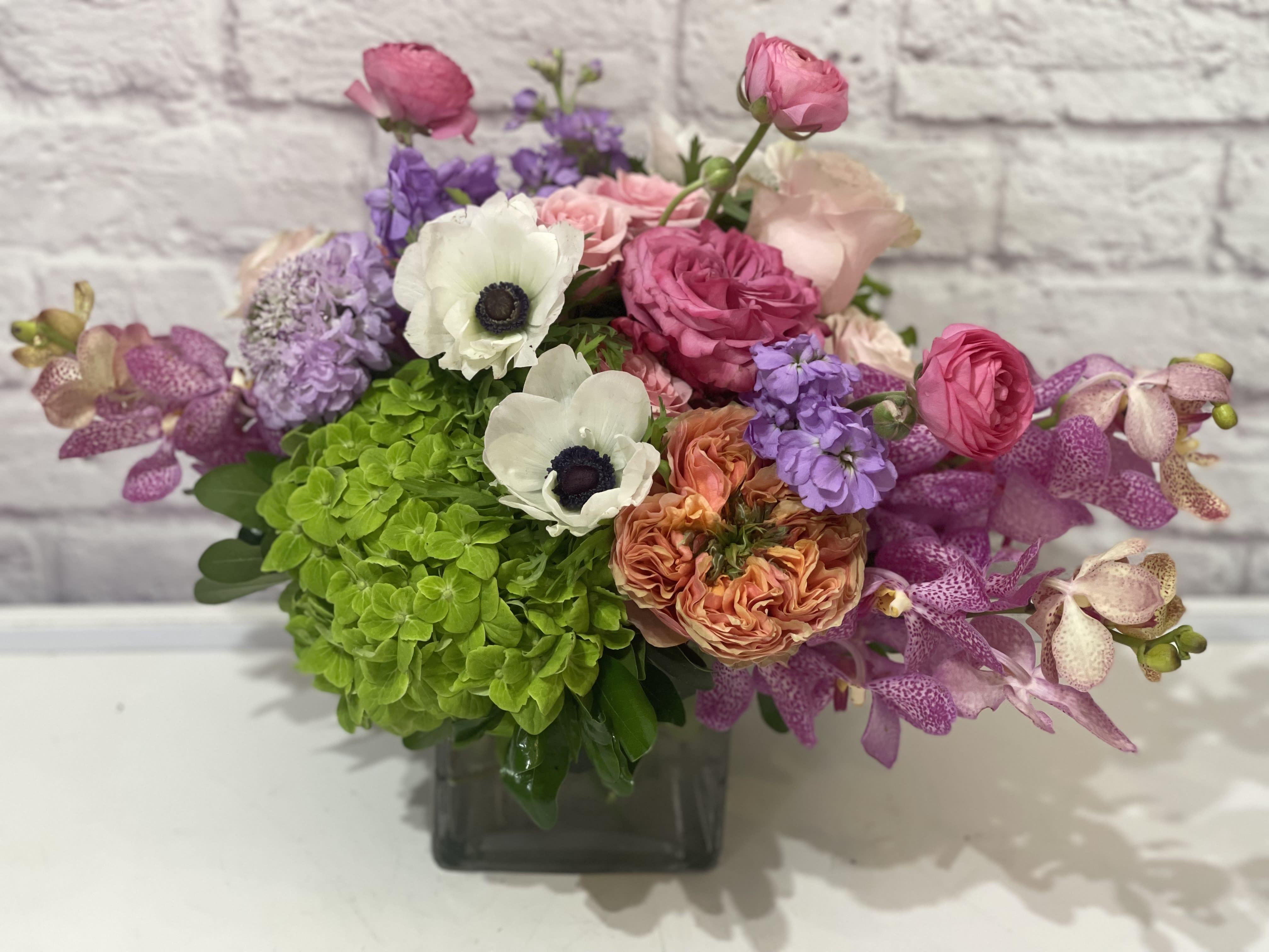 Summer Fling Summer Fling - Bright, colorful, cheerful. A luxurious grouping of high-end seasonal blooms including garden roses, hydrangea, anemone, stock, orchids and ranunculus. Perfect flowers for birthdays, "get well soon," new baby, congratulations, romantic gestures, and "Thank you." Available for delivery in Seattle, Bellevue, Shoreline, and surrounding areas. Available for delivery in all neighborhoods in Seattle including Magnolia, Ballard, Fremont, Downtown, Queen Anne, Crown Hill, U District, West Seattle, International District, Capitol Hill, Pioneer Square, Beacon Hill, Columbia City, Georgetown, etc.