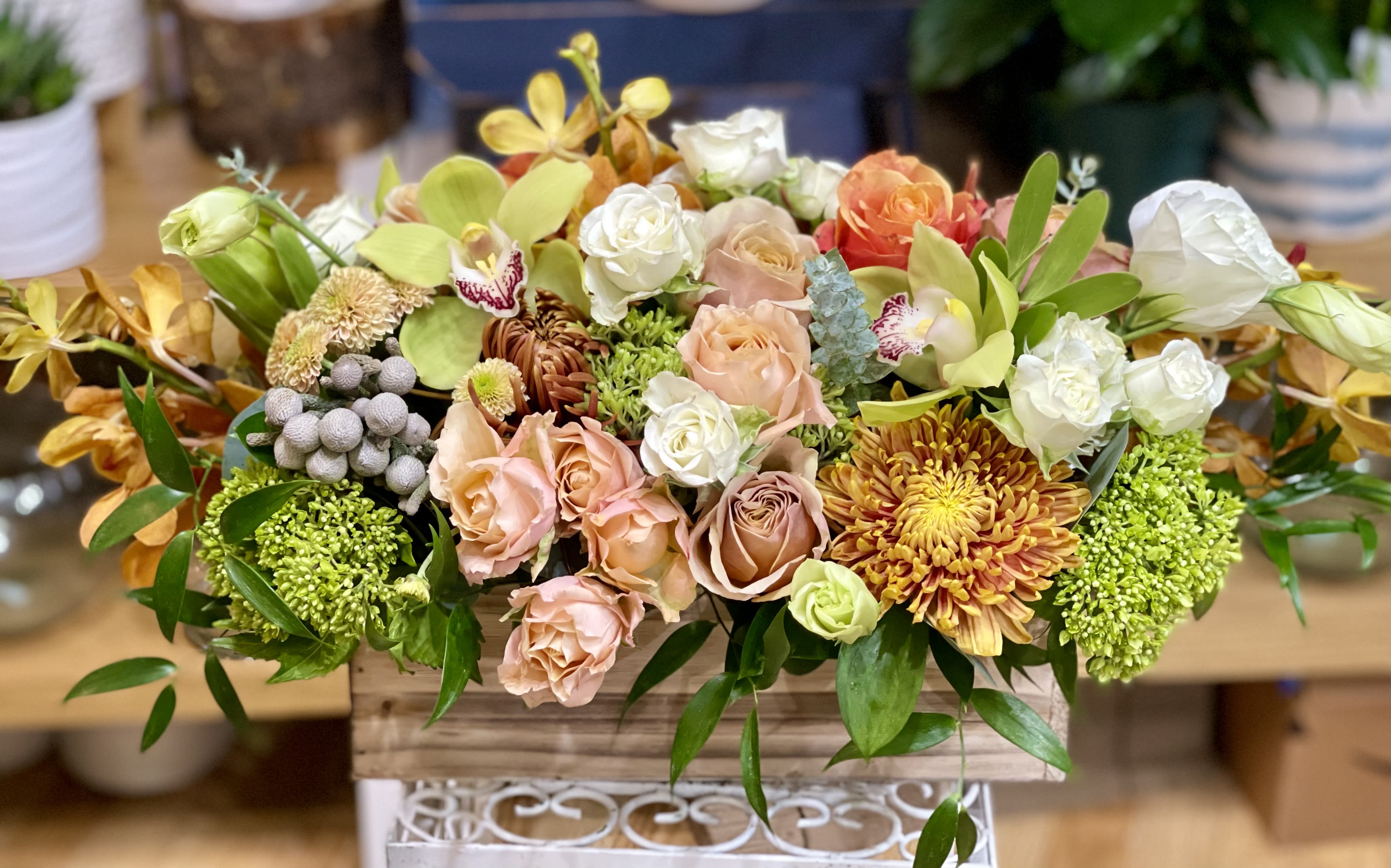 The Van Gogh The Van Gogh - Wooden box filled with luxurious blooms in a muted palette of peach, lime, and copper hues. Perfect flowers for birthdays, "get well soon," sympathy, congratulations, romantic gestures, and "Thank you." Also a beautiful wedding palette. Available for delivery in Seattle, Bellevue, Shoreline, and surrounding areas. Available for delivery in all neighborhoods in Seattle including Magnolia, Ballard, Fremont, Downtown, Queen Anne, Crown Hill, U District, West Seattle, International District, Capitol Hill, Pioneer Square, Beacon Hill, Columbia City, Georgetown, etc.