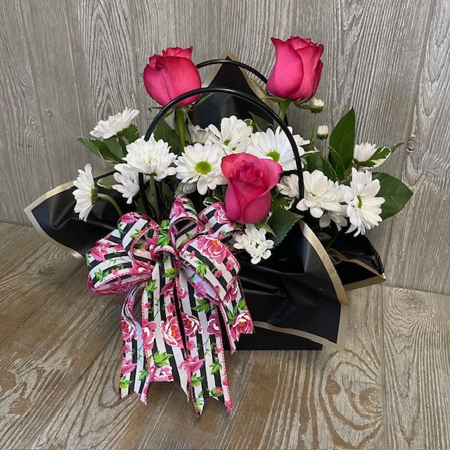 Momma's got a brand new bag! - Kraft Paper Flower Bouquet Bag with flowers for mom.  A one-sided arrangement of hot pink and white flowers with a coordinating bow.  Flowers types and colors may vary.