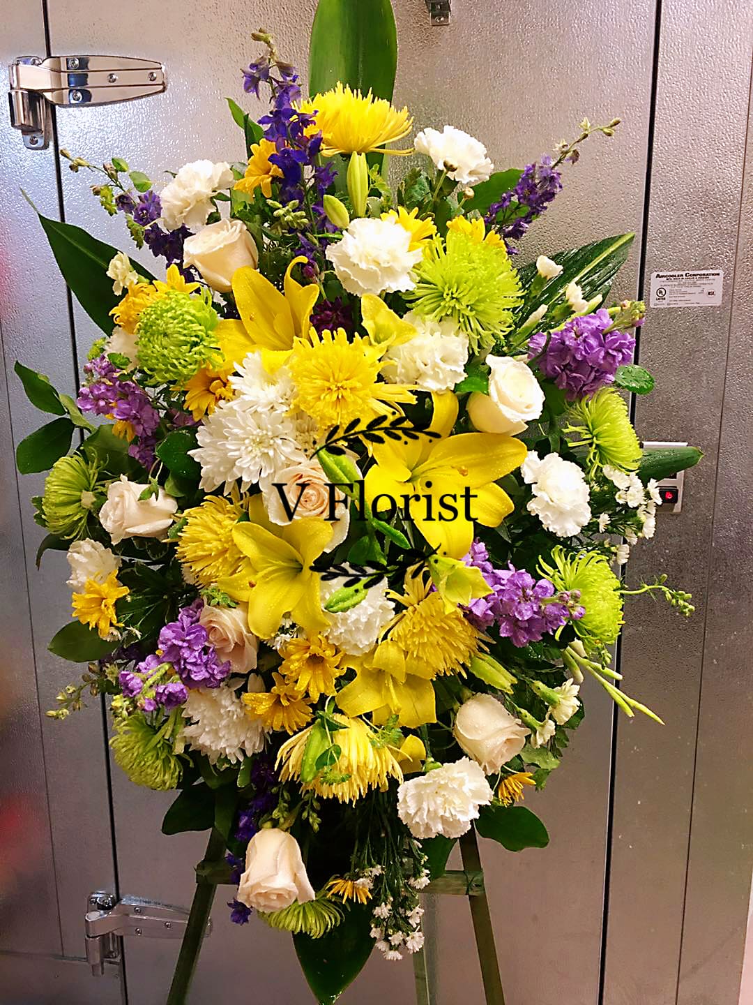 Spirit of Hope Sympathy spray C5 Spirit of Hope Sympathy spray C5 - Take a walk through the garden of memories with this lush spray of purple, yellow, and white blooms, accented with fresh green leaves. It's a joyful expression of sympathy sure to be appreciated. Our florists hand-design each arrangement, so colors and assortment may vary based on local availability Orders must be placed three days in advance to allow for processing