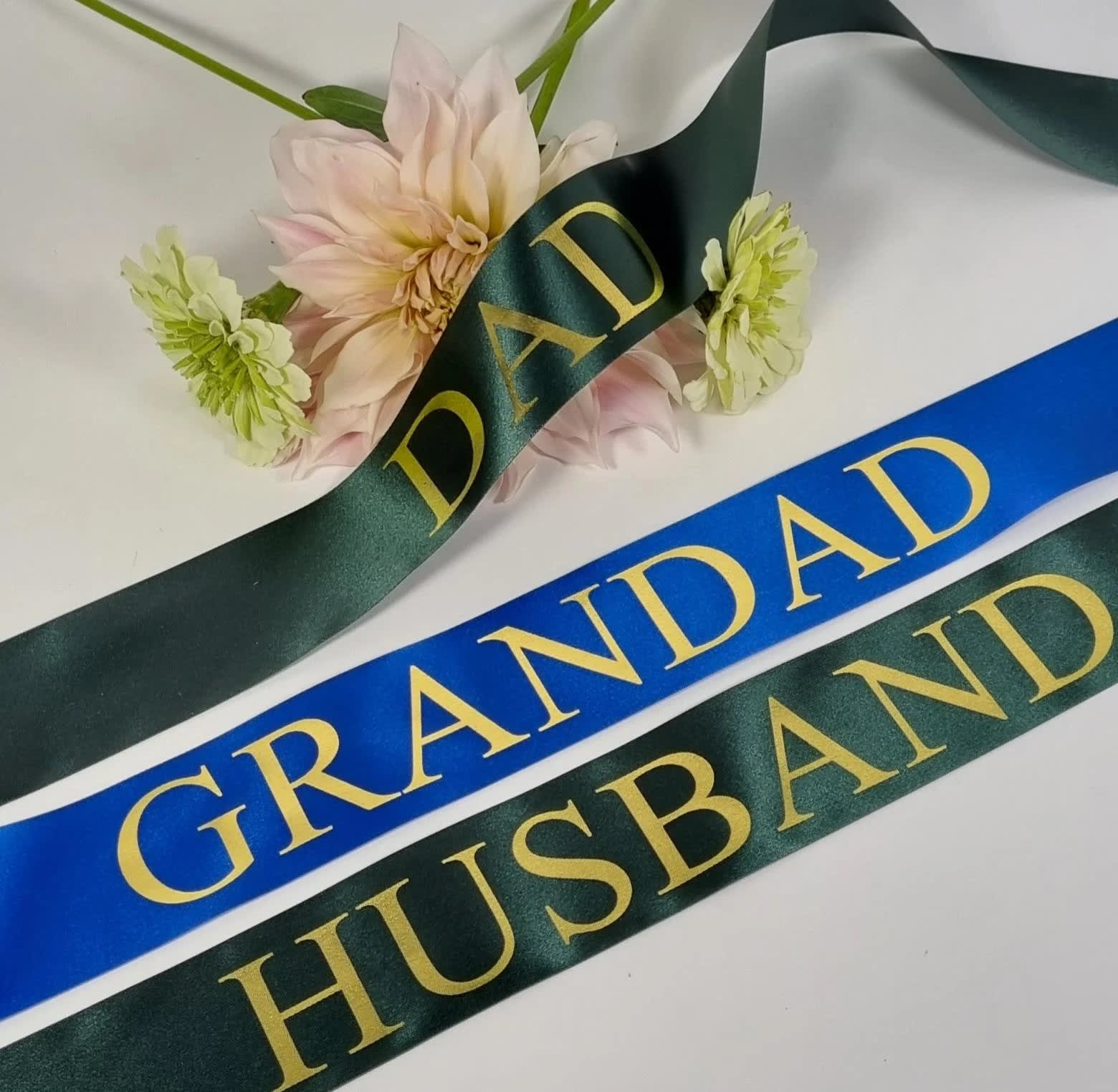 Sympathy Banner Sympathy Banner - Personalize your selection with a custom ribbon banner. If you decide to add a banner please specify in the "Florist Instructions" what color of ribbon and letters you would like for us to use. Ribbon colors available: White, Royal Blue, Red, Pink, Lavender, Black Letter Color: Gold, Silver