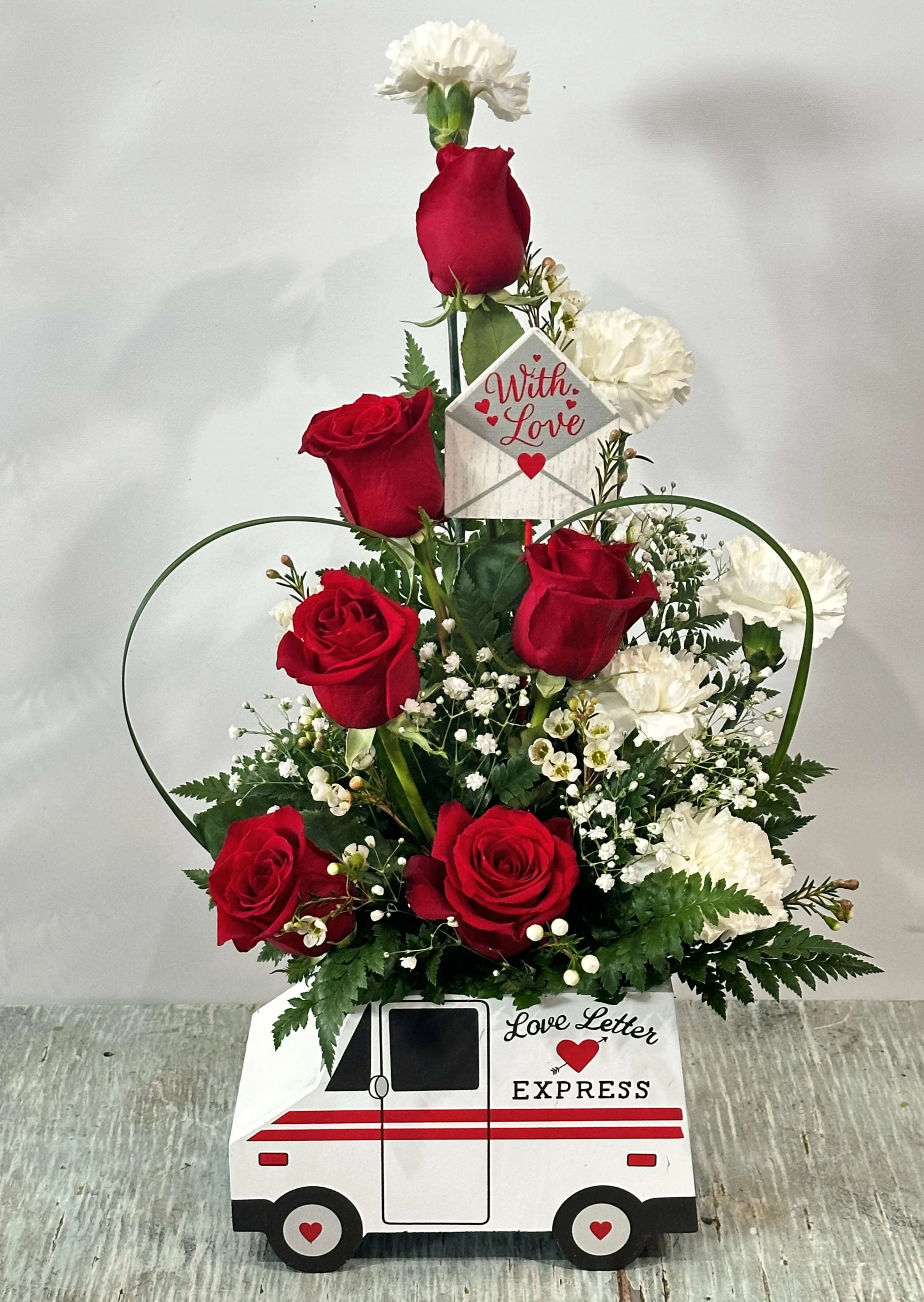 Love &amp; Romance #10 - Arrangement of red roses and white carnations designed in a wooden container to resemble a mail truck that reads &quot;love letter express&quot;. Arrangement measures approximately 20&quot; tall and 10&quot; wide.