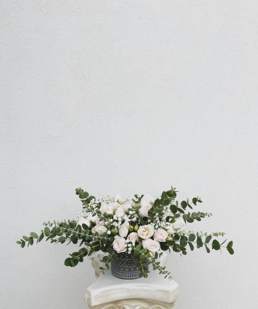 Namastay with Me - The most fragrant arrangement of them all! This beauty will fill your home or the home of your loved ones with the smell of eucalyptus and roses.  Vase is included.  All Sunset Flor arrangements include a flower food package, a care card, and floral info sheet. 