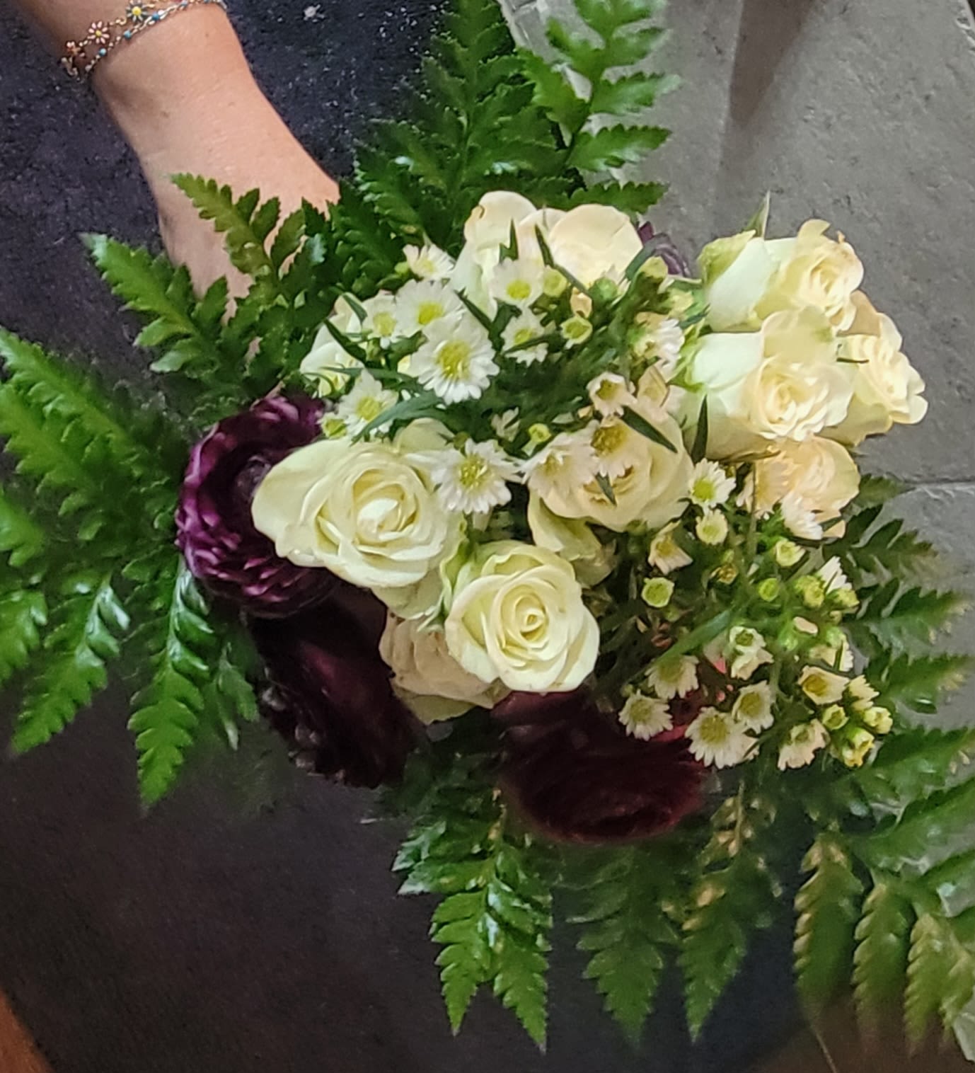 Mini Bouquet by Dixie's Flowers - Ideal for weddings, brides maids, proms and dances.  Arranged with roses, baby breaths and ranunculus flowers.