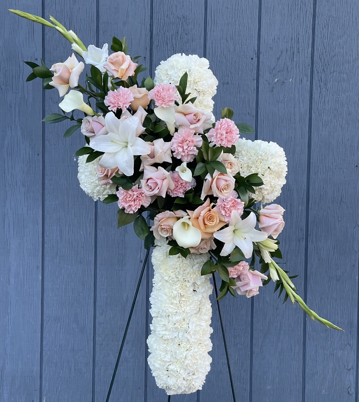 Peaceful pink cross Peaceful pink cross - This is one of our most desirable arrangements for funeral services