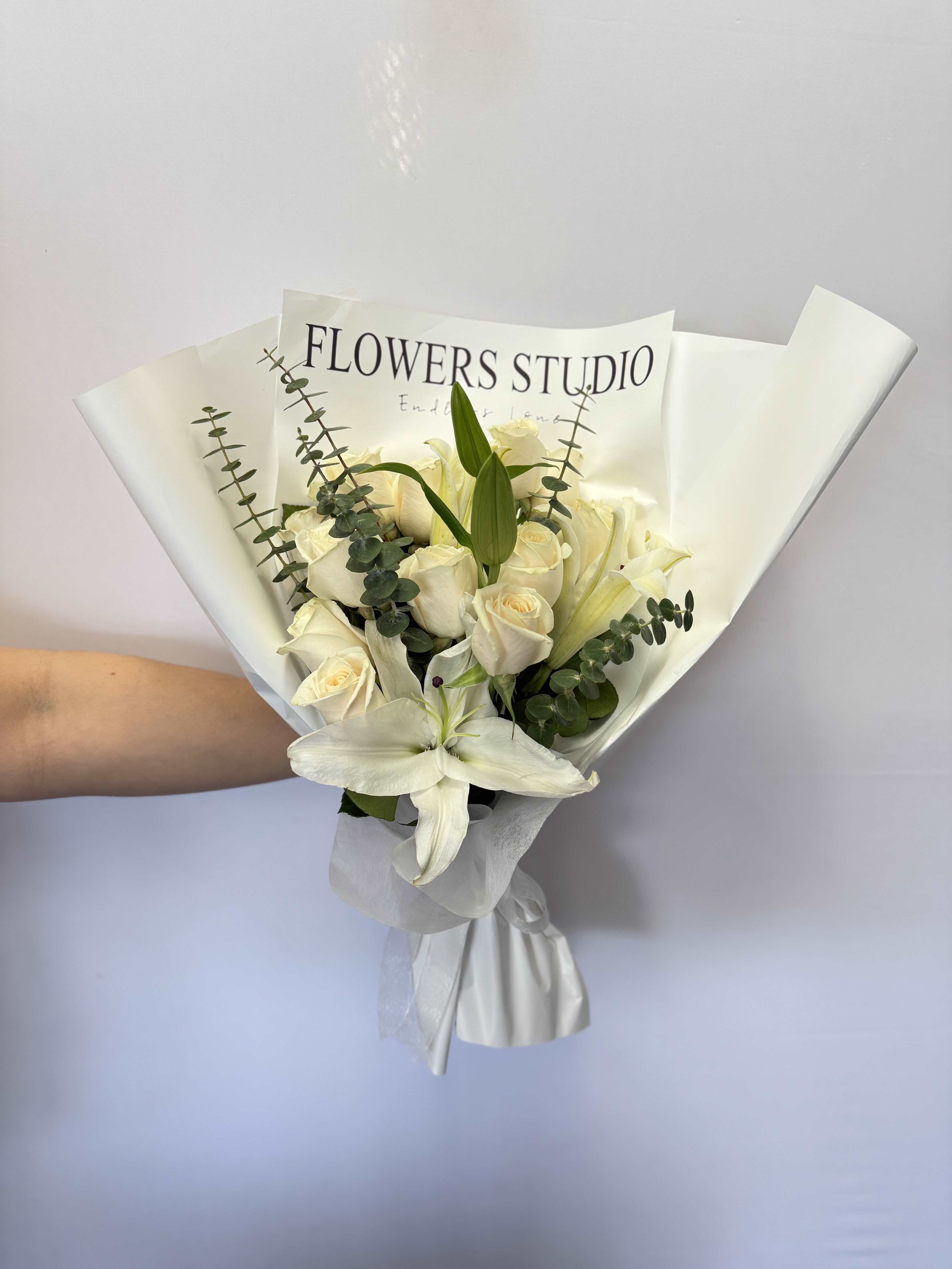 condolences bouquet - Condolence bouquet: a beautiful bouquet with white roses and lilies of the highest quality