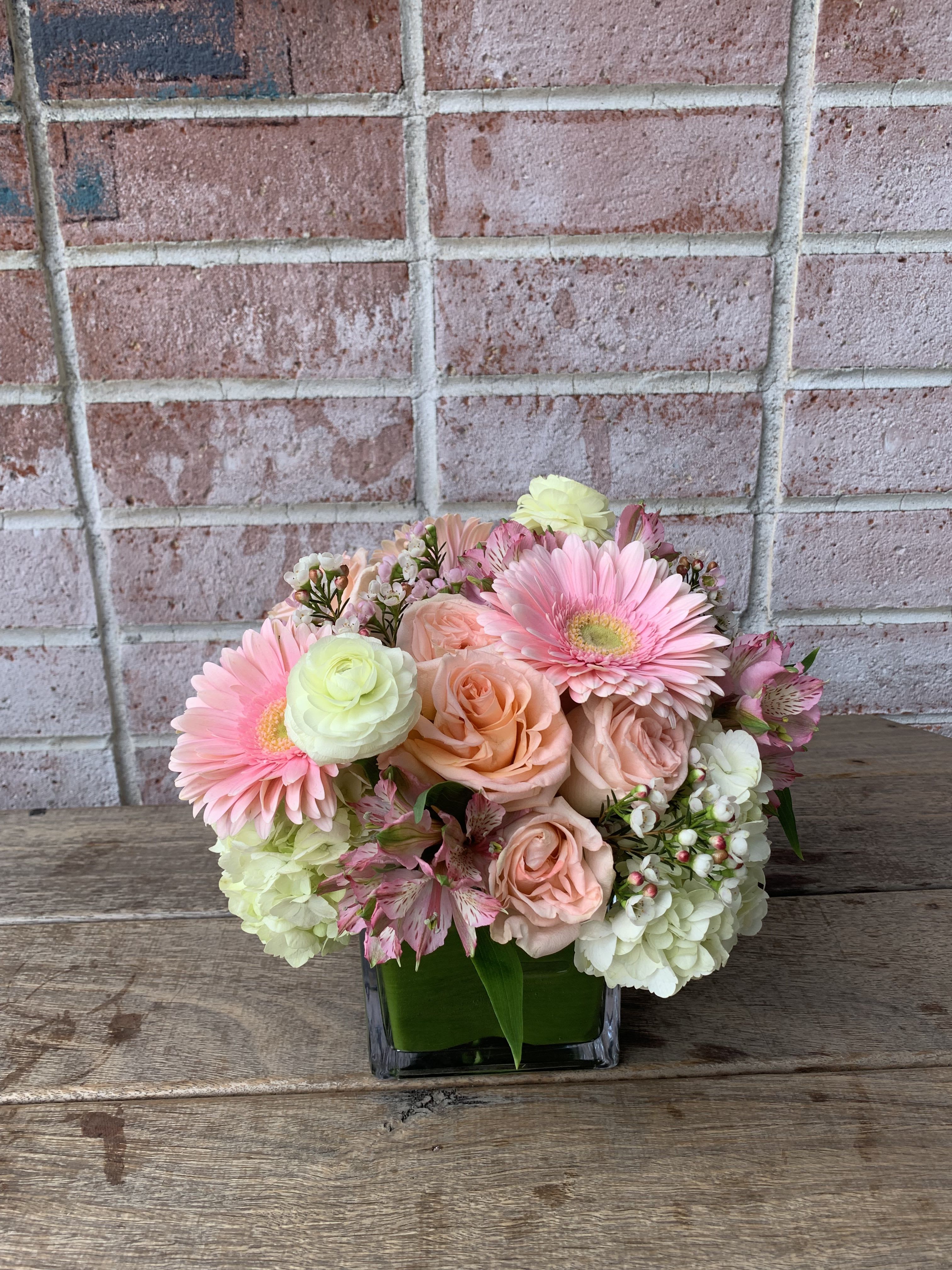 Candy Cane Candy Cane - A cute displace of peach color roses, white hydrangeas, and pink gerbera daisies