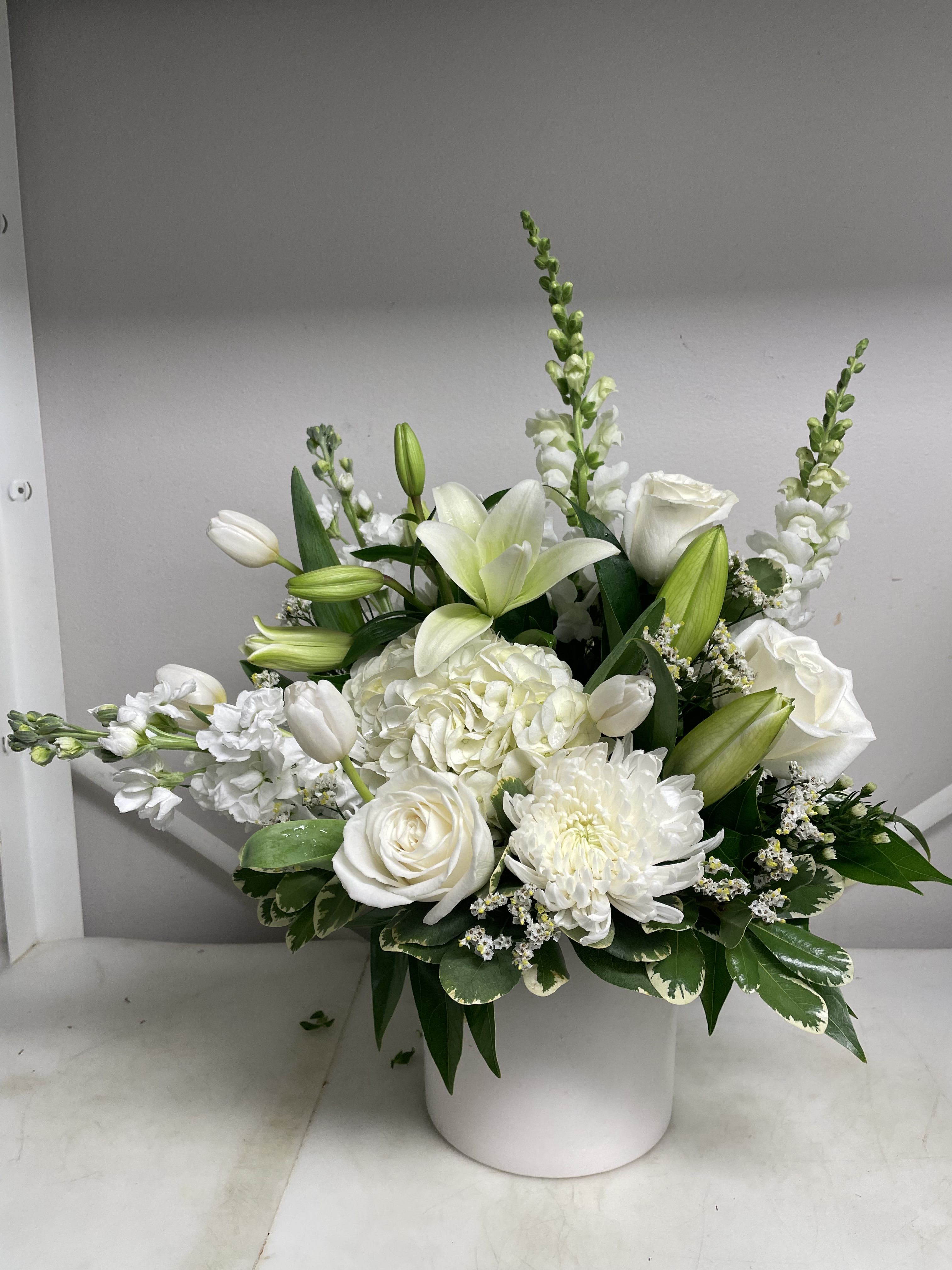 Cool White Cool White - A beautiful white arrangement with a variety of white flowers showcasing its natural elegance.