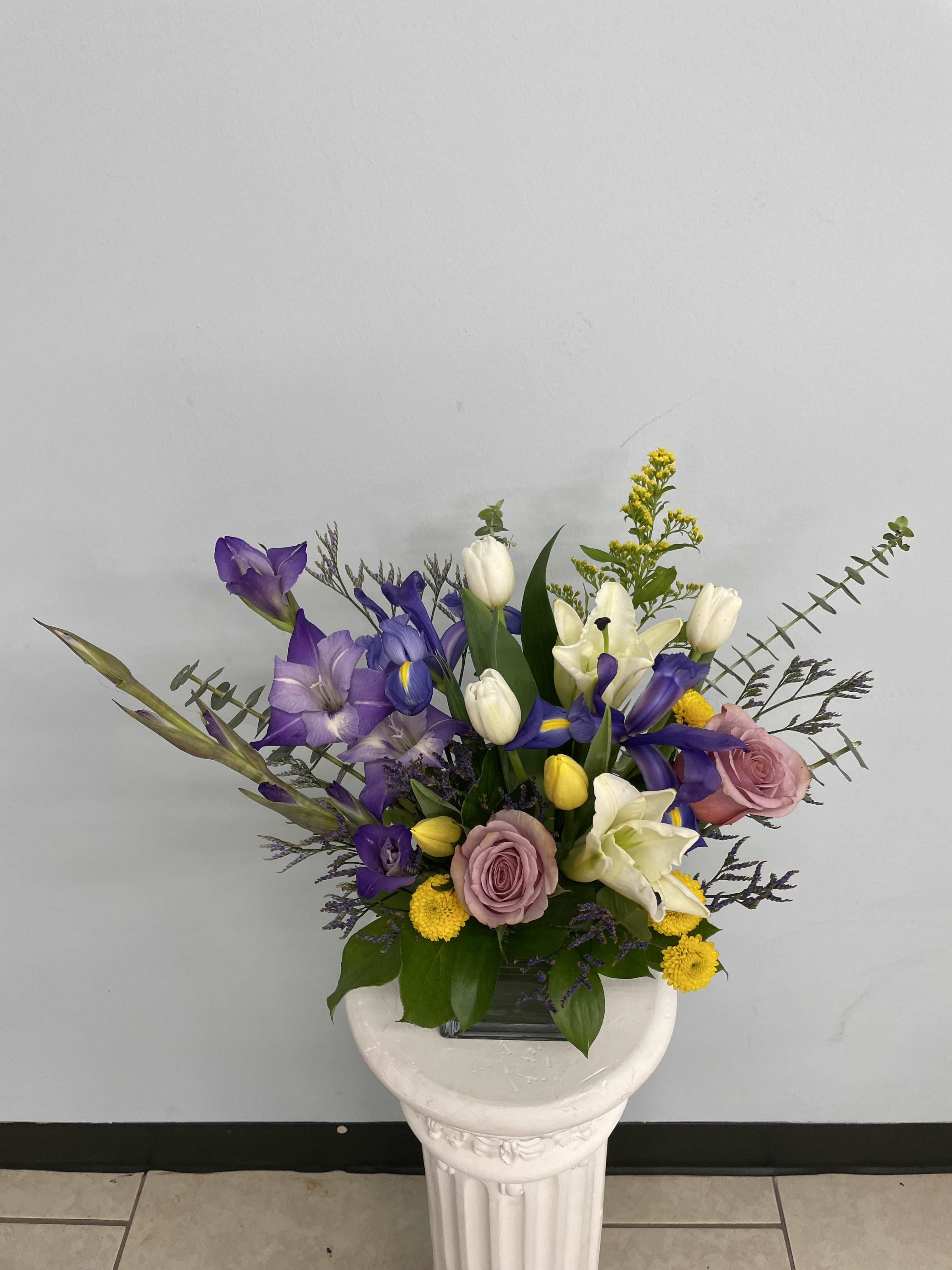 Lavender Fantasy Lavender Fantasy - A mix of beautiful purple shades in one arrangement with touches of white and yellow. A beautiful arrangement for anyone special and any occasion!